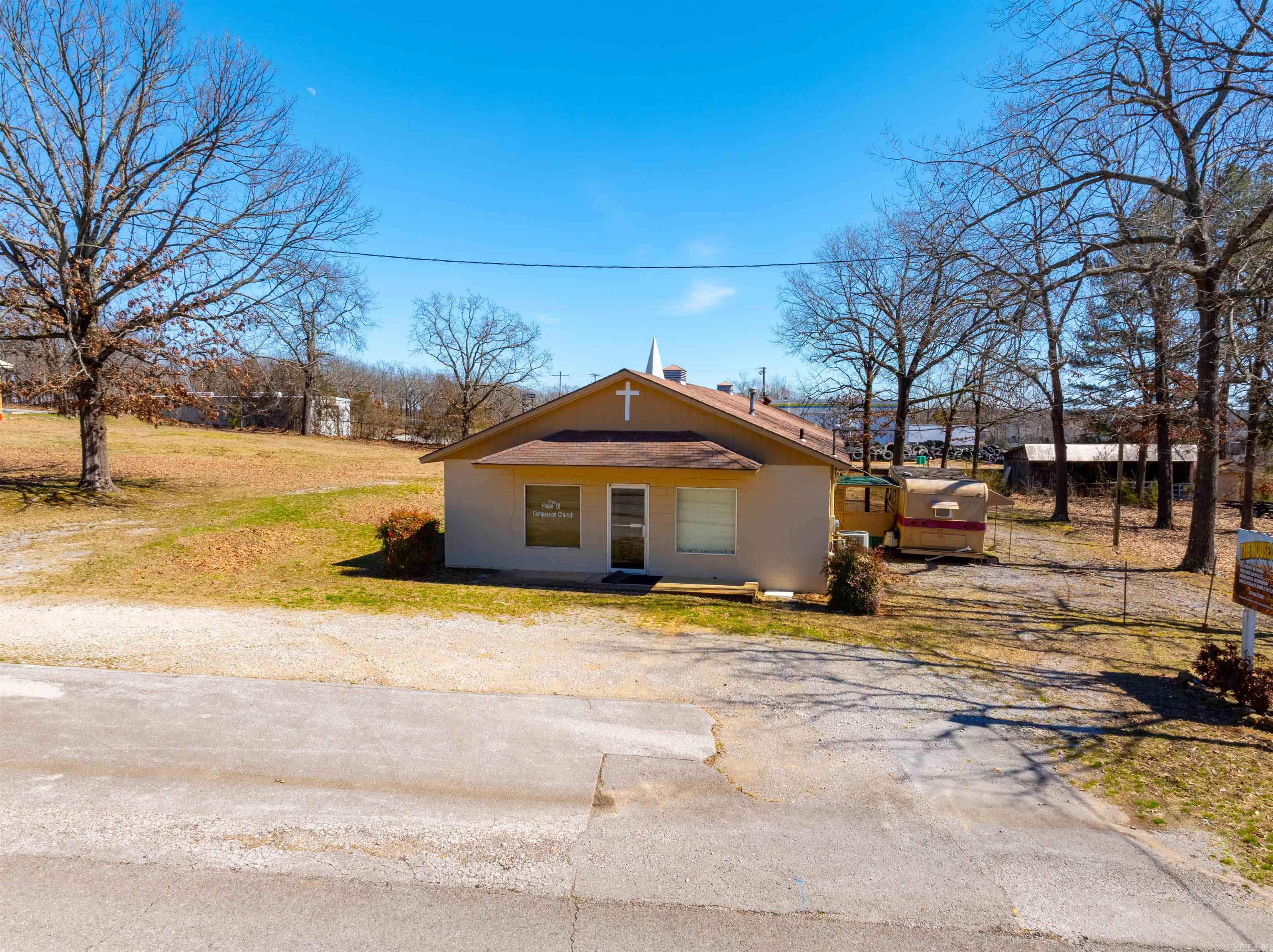 Church in Southside's Residential neighborhood located just off HWY 25/Heber Springs Road!!  Presenting a unique commercial opportunity in Southside, Arkansas! This church building, situated within a quiet residential neighborhood, is zoned C-1, offering a variety of potential uses for business owners and investors.  The property features a spacious, open sanctuary, ideal for retail, office space, or community-oriented businesses. A fully equipped kitchen provides added convenience, while four half baths and a separate shower room enhance the functionality of the space. A detached storage building offers ample room for inventory, equipment, or additional workspace.  With its C-1 zoning, this property opens doors to a range of possibilities, including (but not limited to):  Retail sales Professional offices Service businesses Ministry Apartments  Important Note: Buyers are advised to conduct thorough due diligence regarding specific permitted uses within the C-1 zoning regulations with the City of Southside. All contents are being conveyed with purchase.