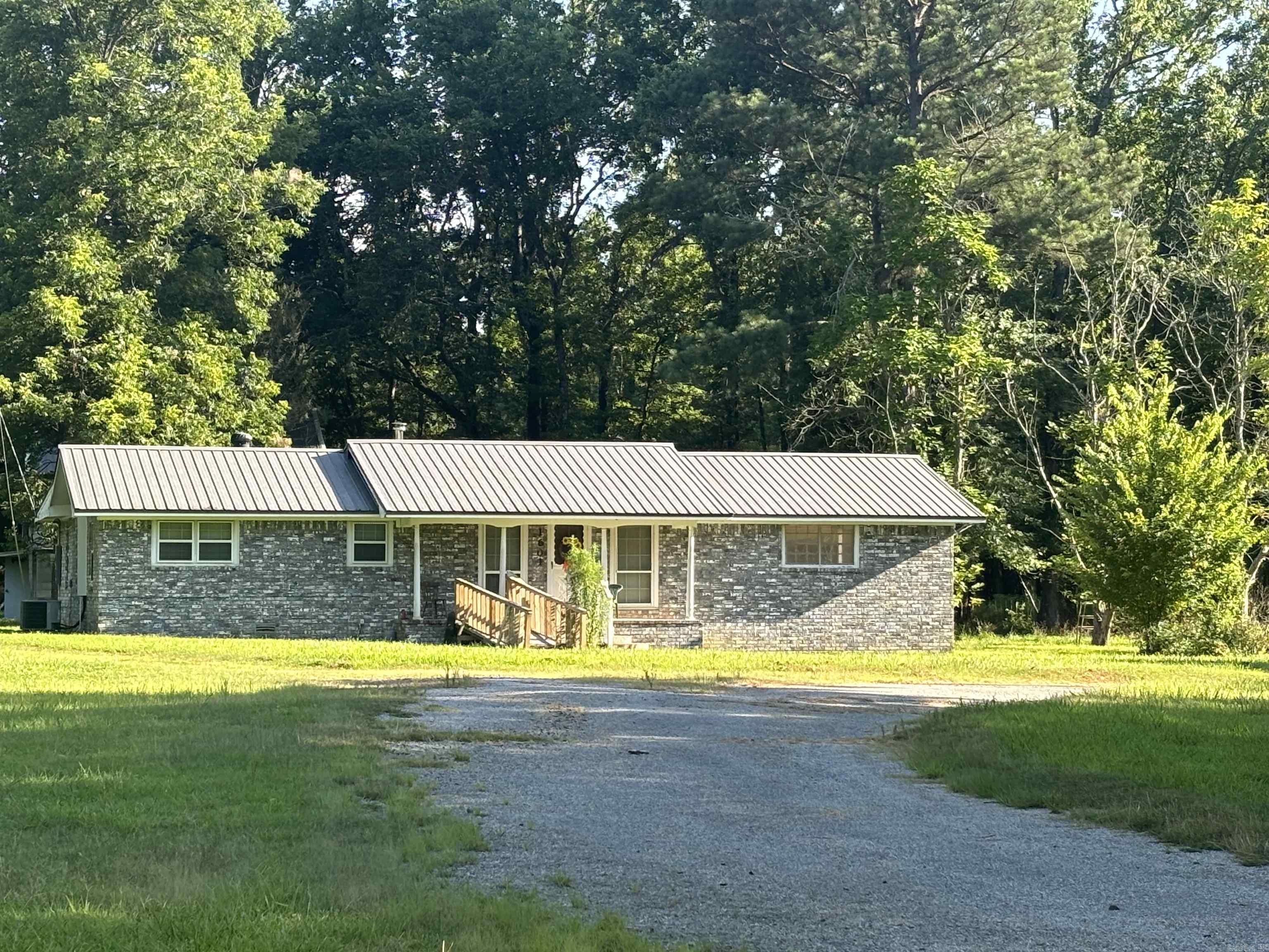 Are you looking for country living?  Well here it is!  This 3bdrm, 2 bath home sits on 5.34 acres!  Bring you animals this property is partially fenced and ready to go!  Alot of opportunities exist here!  Home is dated but has good bones, brick exterior & metal roof!  Enojoy relaxing on your enclosed back porch.  Plenty of room for parking with your 3 car carport!  You can use the nice metal shop outback for whatever you desire!  There is an old home place up front good for extra storage as well!  This property is one of kind with so many options!  Bring your family to enjoy or buy as an investment property!  Austin, Arkansas!  Cabot Schools! SOLD AS IS!!!!