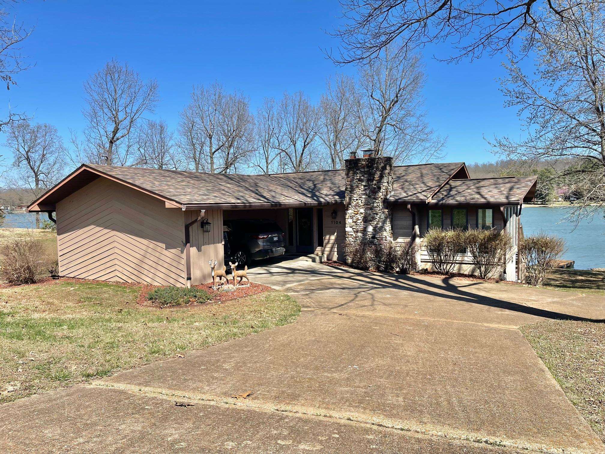 Crown this Lakefront as Yours…2 Bdrms, 3 Baths, carport, extra storage, plus a partially finished basement (not included in square footage) & sunroom. Two lots embracing privacy with a large private dock designed for expansion. From the partially wooded setting, along a beautiful fishing shoreline, to the inviting opportunities to sit by the fireplace, wood stove or campfire, the setting is a western cedar dream.
