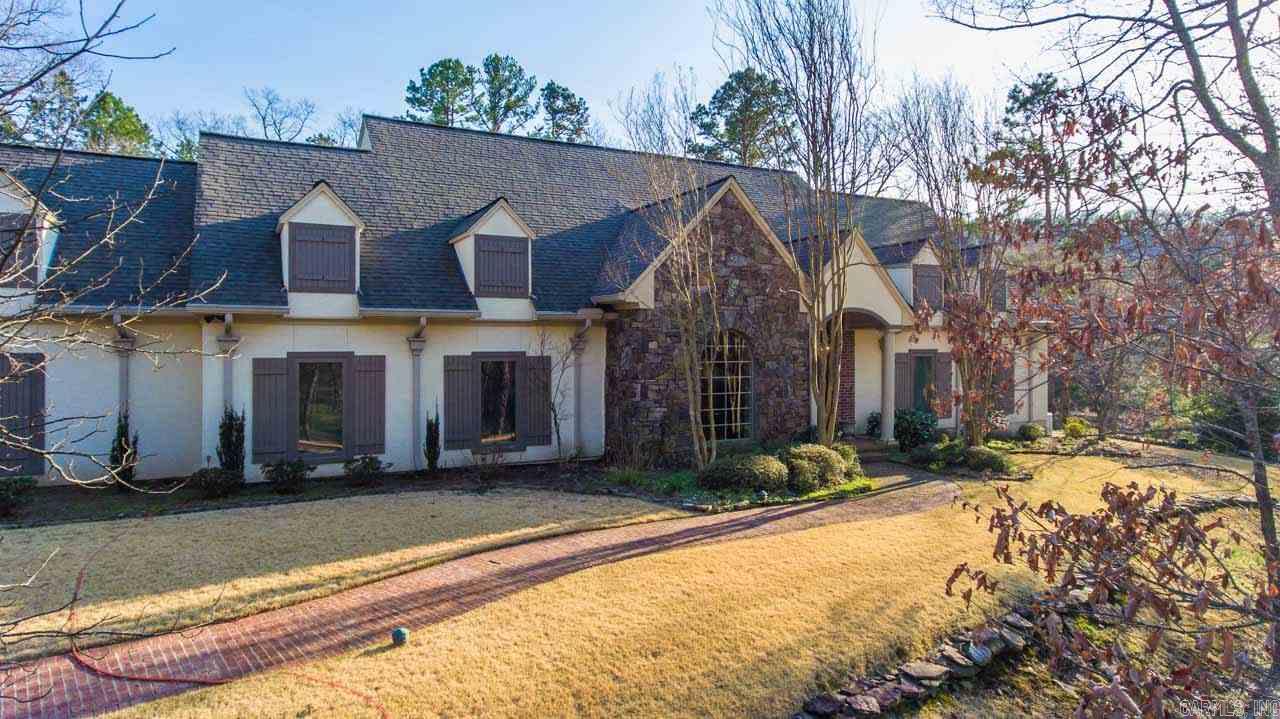 Welcome to your very own resort in the heart of LR. This home has a private gate to its 10.78 acres including a 1 acre stocked spring fed pond. The sprinkler actually runs off of the pond.The home features a newly remodeled kitchen and a new addition that provides a second living area. The property also includes a full house generator, walking trails, and a shop/fishing shack/man cave next to the pond.  The outside living of this home is absolutely beautiful and very private, aprox 3 miles from Chenal Pkwy.