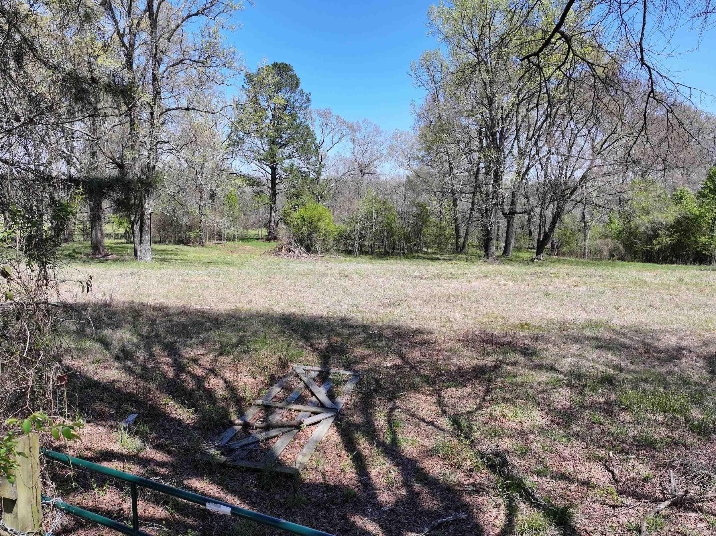 A rare opportunity in the heart of Glenwood city limits! This expansive 12.42± acre parcel of land presents limitless possibilities for investors, developers, for those seeking the ideal location for their next dream home, or can be turned into lots to subdivide! Property includes a small pond and stream. Located conveniently near local town amenities while still offering privacy.