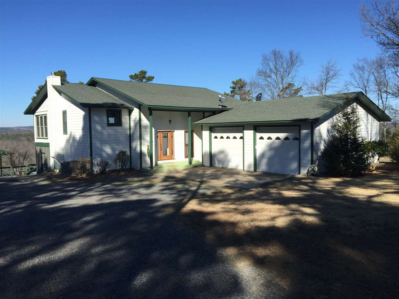 If you're looking for spectacular VIEWS of the Lake & Mountains,almost 9 acres with Lakehouse & Guest house ,30&50amp RV Hookups with its own septic,Barn,outbuildings,& More..This is FOR YOU!"Serenity" is currently a VRBO.com rental that was Custom built in 2004 w/2400sq.ft., EXTRA thick walls,Insulation,Energy Efficient,Attached 2-car drive through garages, huge decks,Large screened in Porch & SAFE ROOM downstairs.The guest home was built in 2013 w/2149sq.ft. incl.3 bedrooms, 2 baths & Office.