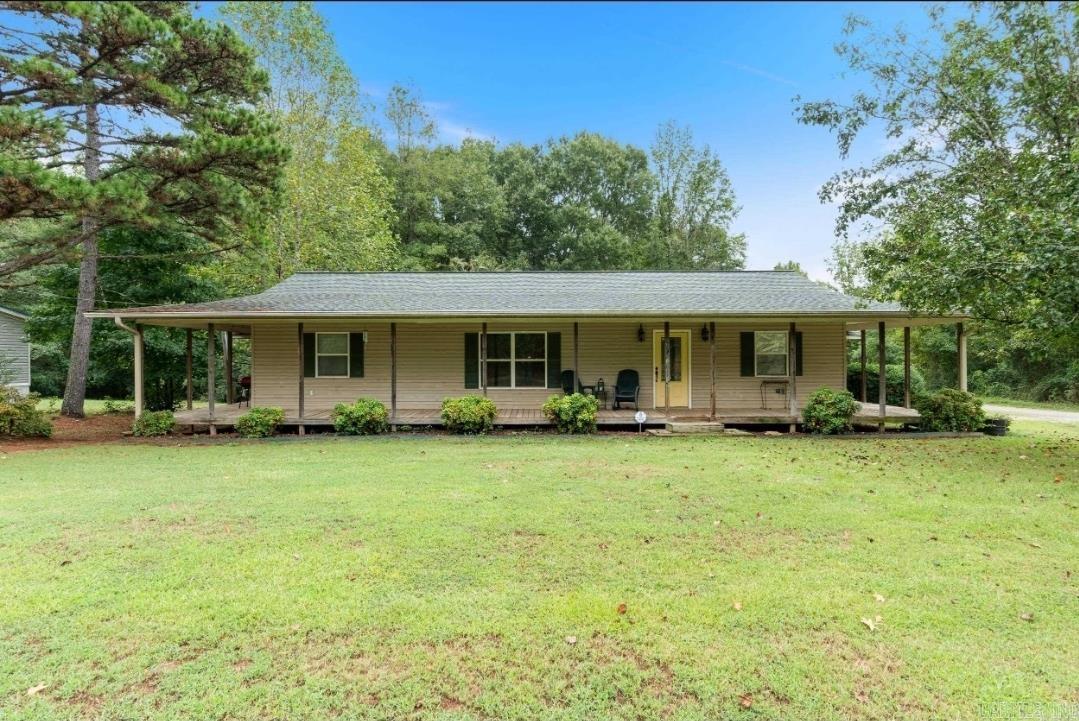 This well-maintained 3 bedroom, 2 bathroom manufactured home sits on approximately .75 of an acre in a quiet area near the river, offering plenty of space and a peaceful setting.  Inside, you’ll find an open floor plan with a spacious kitchen featuring a large farmhouse sink and island, perfect for cooking and gathering. The home also includes a large front porch and covered back patio, giving you plenty of room to relax and enjoy the outdoors.  All appliances stay with the home, making it move-in ready. The home has a newer roof and HVAC system, along with additional window units for extra cooling comfort. The septic system was serviced 3 years ago, and major updates include attic insulation and crawlspace encapsulation completed in 2025.  The home was completely remodeled and added onto in 2001, blending updated features with extra living space. The property stretches all the way to the opposite corner, offering additional room and potential for another home or future expansion.  If you’re looking for space, updates, and a quiet location close to the river, this property is definitely worth a look.