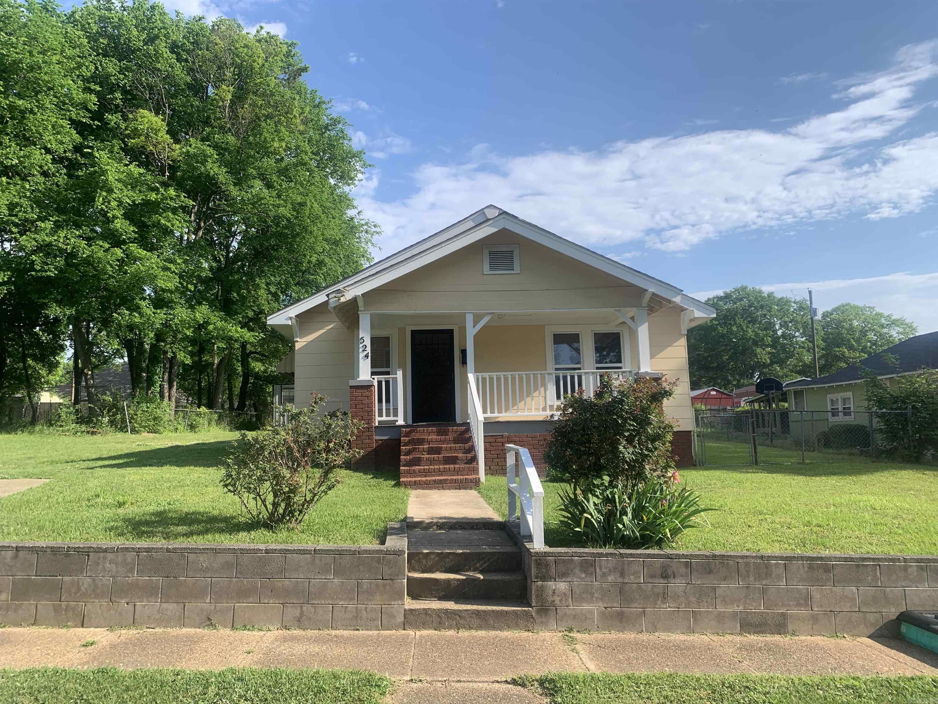 Bright and inviting, this charming 2-bedroom, 1-bath home offers a blend of character and versatility. Featuring cheerful tones of yellow and blue throughout, the home includes an extended living and dining area that provides a flexible layout to suit a variety of needs.  Enjoy time on the front porch, perfect for rocking chairs, or make use of the patio space ideal for grilling and outdoor gatherings. The fully fenced backyard offers space for outdoor activities, while the additional shed/workshop provides options for storage, hobbies, or workspace.  Recent updates include a new roof installed in 2025 and a hot water tank replaced in 2021.  Square footage is taken from Data Scout and should be independently verified by buyer. Listing agent related to seller. Agents please see remarks.
