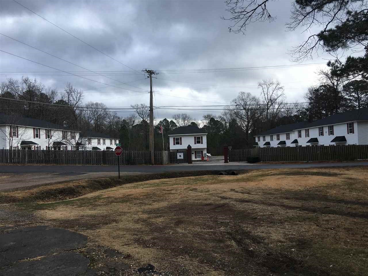 Exceptional investment opportunity to purchase 20 townhomes in the Lake Hamilton School District. Springwood Townhomes is a 20 unit multi-family gated development containing 20 2 bedroom and 2.5 bathroom units, rental office and managers quarters. All units are separately metered. Owner will consider long term owner financing to a qualified buyer. Approval for 20 more townhomes has been approved by the city according to the owner.
