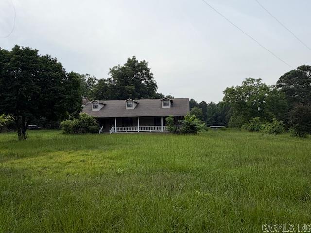 If you're looking for peace, privacy, and tranquility, look no further! This charming 3-bedroom, 2-bath home sits on 4.49 beautiful acres and offers the perfect country retreat. The property includes two barns, providing plenty of space for livestock, hobbies, storage, or equipment.  Inside, you'll love the spacious kitchen with ample cabinet and counter space, making it ideal for cooking and entertaining. Cozy up by the fireplace on chilly evenings and enjoy the comfort and warmth of home. Whether you're looking for room to roam, a small farm, or simply a peaceful place to call your own, this property has it all!
