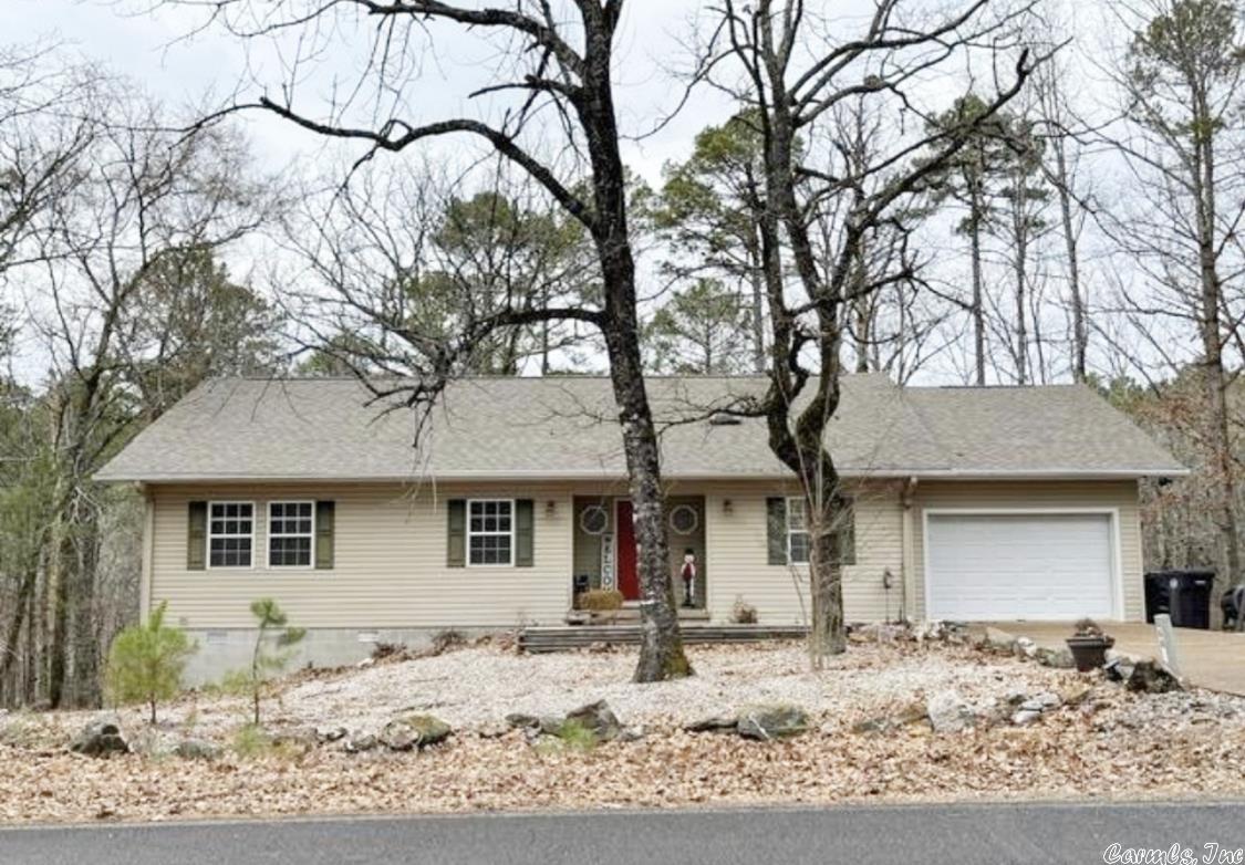 Beautiful, spacious, 3 bedroom, 2.5 bath home on 2 partially wooded, secluded lots. Sunroom that overlooks the large back deck. Granite countertops in the kitchen. Jenn-air vented stove top and oven. Open kitchen, dining, den area. A/C 2021. Roof approximately 2017. Property backs up to a creek. Many amenities are included in this area. At the completion of the bypass, the distance to area attractions will be much closer.  Call for an appointment and make this your home!