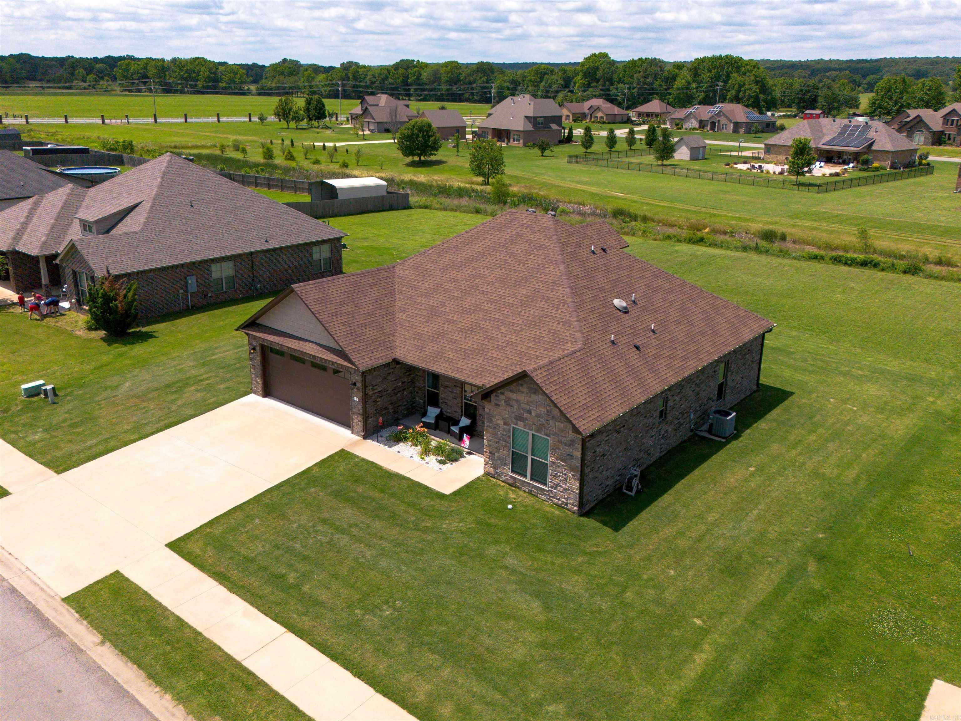 If you're looking for a home with space, quality finishes, and features that are hard to find this one owner, 4-bedroom, 2.5bathroom home in Saddlecreek subdivision checks all the boxes!  Highlights include: 1/2 acre lot, LG appliances solid surface quartz countertops, 8 ft island in kitchen with spacious pantry, soft close cabinetry, stainless steel appliances, luxury vinyl flooring, gas fireplace, tankless water heater, central vacuum system that includes a port in garage for cleaning vehicles, recessed lighting, custom shelves in study, tornado shelter in main closet, primary bathroom has relaxing whirlpool tub, spacious upstairs bonus room with its own private AC and half bath perfect for home office, game room, guest space, or hobby area. Also has spray and blow insulation and a walk in attic!  Exterior has oversized garage and large covered 20x20 patio!  If you're moving to Central Arkansas you will want to see this beautiful Vilonia home!   Agents see remarks