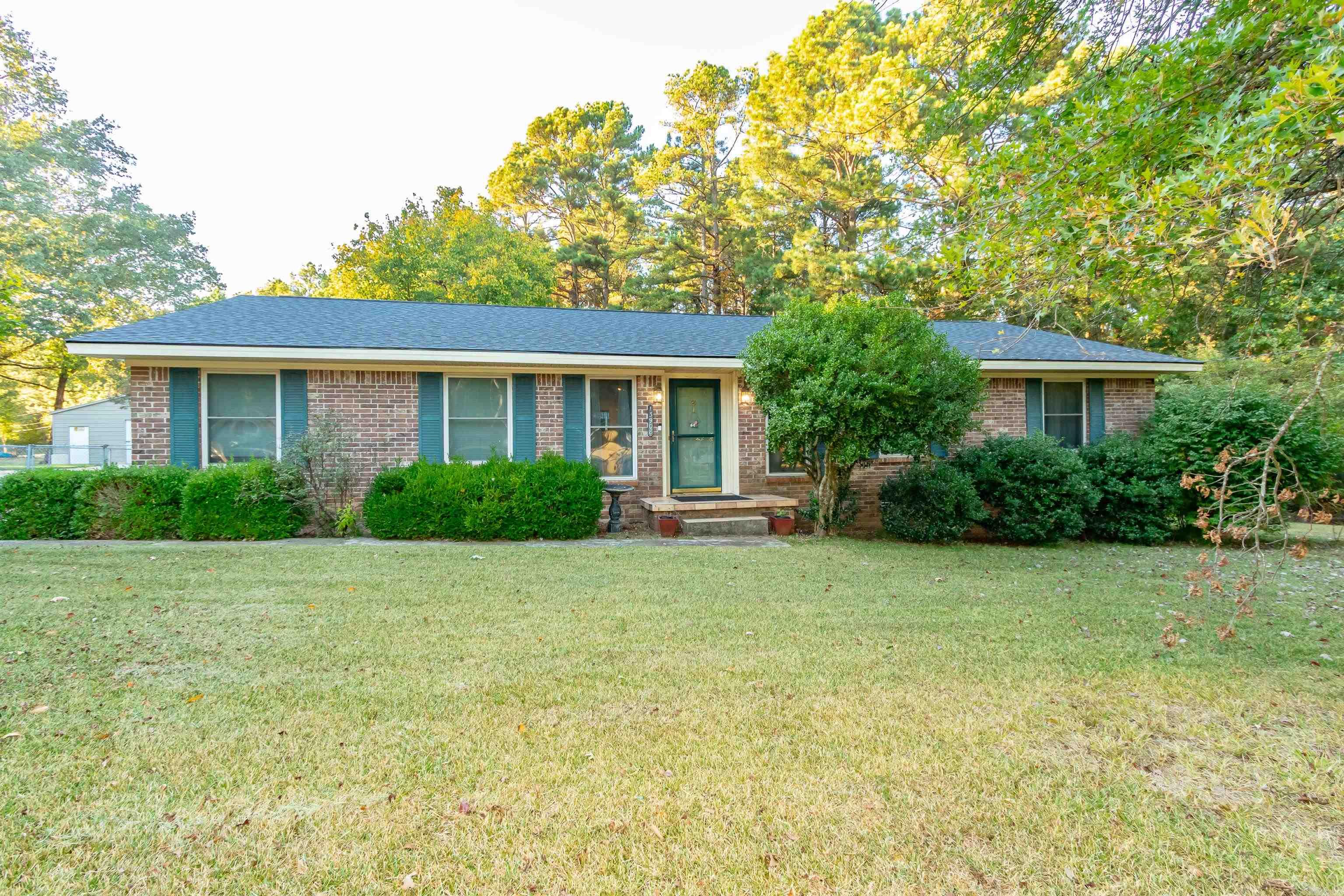 Welcome to this charming 3-bedroom, 1.5-bath home that offers the best of both worlds! Nestled on a large lot with over half an acre and greenspace directly behind, you'll enjoy nature right in your backyard. The spacious shop is perfect for hobbyists or extra storage needs. Inside, the well-designed layout includes a cozy living area, a functional kitchen, and comfortable bedrooms. Despite its peaceful surroundings, this home is just minutes from shopping, dining, and all the conveniences of town, making it the perfect retreat that still keeps you close to everything.
