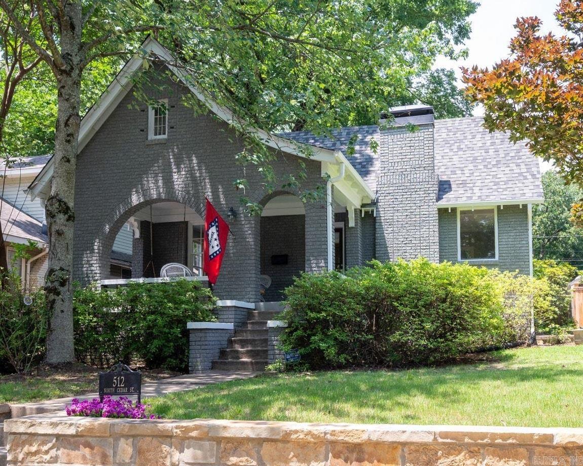 Less than a block from the Hillcrest Farmers’ Market! Cedar is one of the most historic streets in Hillcrest. Enjoy your morning coffee on the porch & then walk the kids to school 2 blocks south or head 1 block north to Hillcrest Commons for yoga, meditation, or an evening concert. For dinner & dessert (Loblolly ice cream!), stroll the Allsopp Park Promenade to the business district 4½ blocks west. This home earns its “very walkable” rating! Among its features: refinished original hardwood floors, gas log fireplace, rewired antique lighting, voluminous custom closets and built-ins, “secret passage” closets b/w the front bedrooms, fully-floored attic, new pedestal sink & glassed tub/shower, new quartz countertops, new GE conv. gas stove w/air fryer, new GE dishwasher w/3rd rack, and new stone retaining wall. The extra-large covered patio looks onto your fenced backyard w/rose & fig bushes & gas line. Arkansas flag, front porch furniture, string lights, hammock & patio tv convey. Also new in 2026: crawl space encapsulation w/dehumidifier, rewired electrics (no more knob & tube!), garbage disposal, carpet, paint inside & out, programmable thermostat, etc. 3D tour. AGENTS SEE REMARKS!!