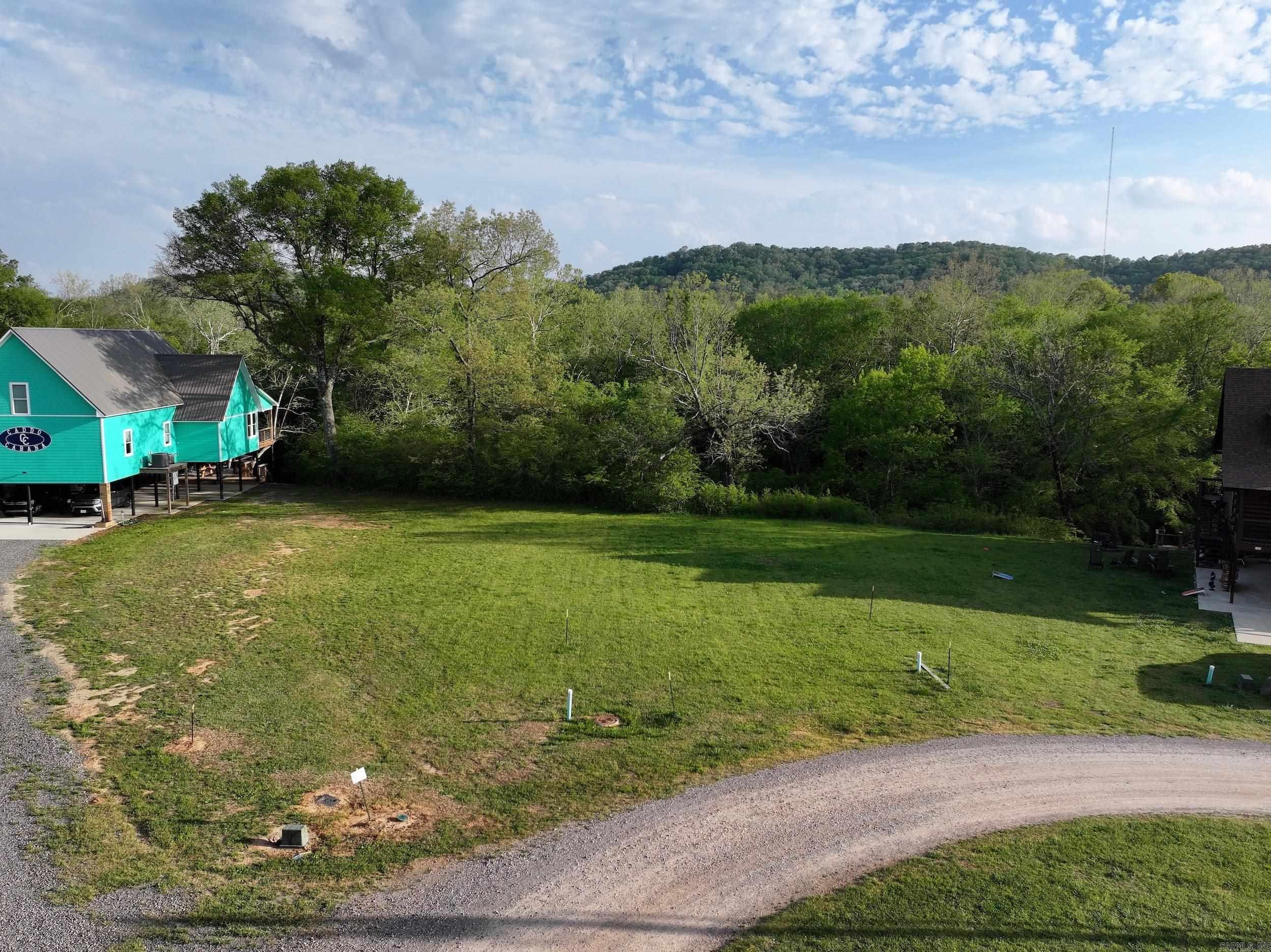 Discover your ideal riverfront retreat! These generous subdivision lots along the scenic Caddo River provide an exceptional opportunity to build your custom waterfront home. Boasting approximately 240 ± feet of river frontage, these lots offer convenient access for fishing, kayaking, and other water activities. Surrounded by natural beauty, each lot provides ample space to design your perfect getaway. Don’t miss the chance to secure your slice of riverfront paradise!