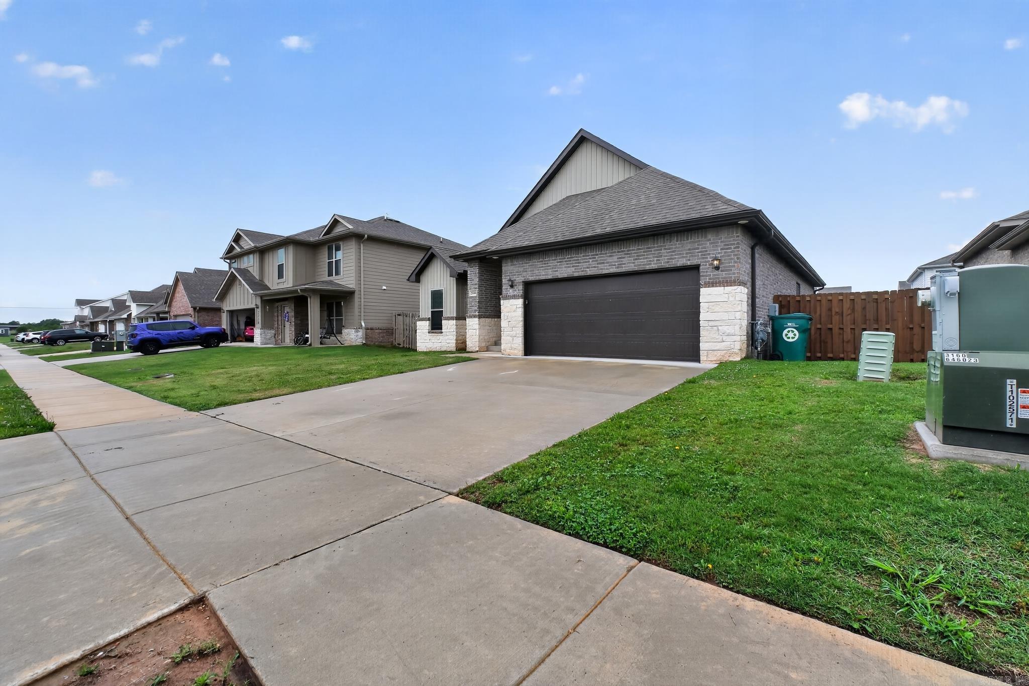 Welcome to this stunning two-story home in the sought-after Prairie Brook community. Built in 2023, this modern 3-bedroom, 2.5-bathroom residence features an open-concept layout perfect for entertaining. The main floor offers a private primary suite, while the upstairs boasts spacious secondary bedrooms and a versatile loft area. Enjoy a contemporary kitchen with sleek finishes and an eat-in dining space. Step outside to a level backyard or take advantage of neighborhood amenities, including a community pool and playground. Perfectly situated in the Bentonville School District, just minutes from shopping and the Walmart Home Office.
