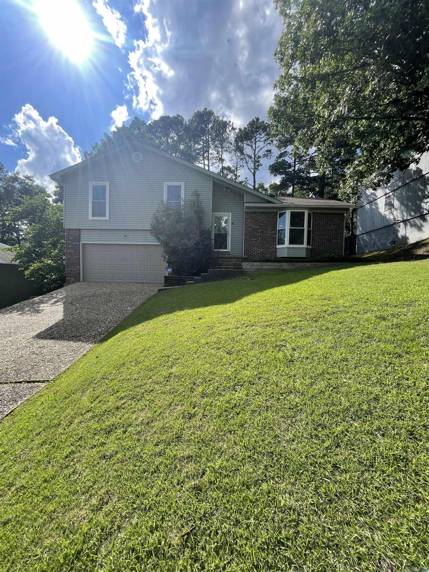 This charming single-family home located in a quiet cul-de-sac within the desirable Pleasant View area of WLR. The property features 1553 square feet of living space with 3 bedrooms, 2 bathrooms, hardwood flooring, a gas fireplace, and a spacious deck overlooking a fenced backyard with mature trees. The home also includes a two-car garage and offers convenient access to top-rated schools, parks, shopping, and west Little Rock amenities.