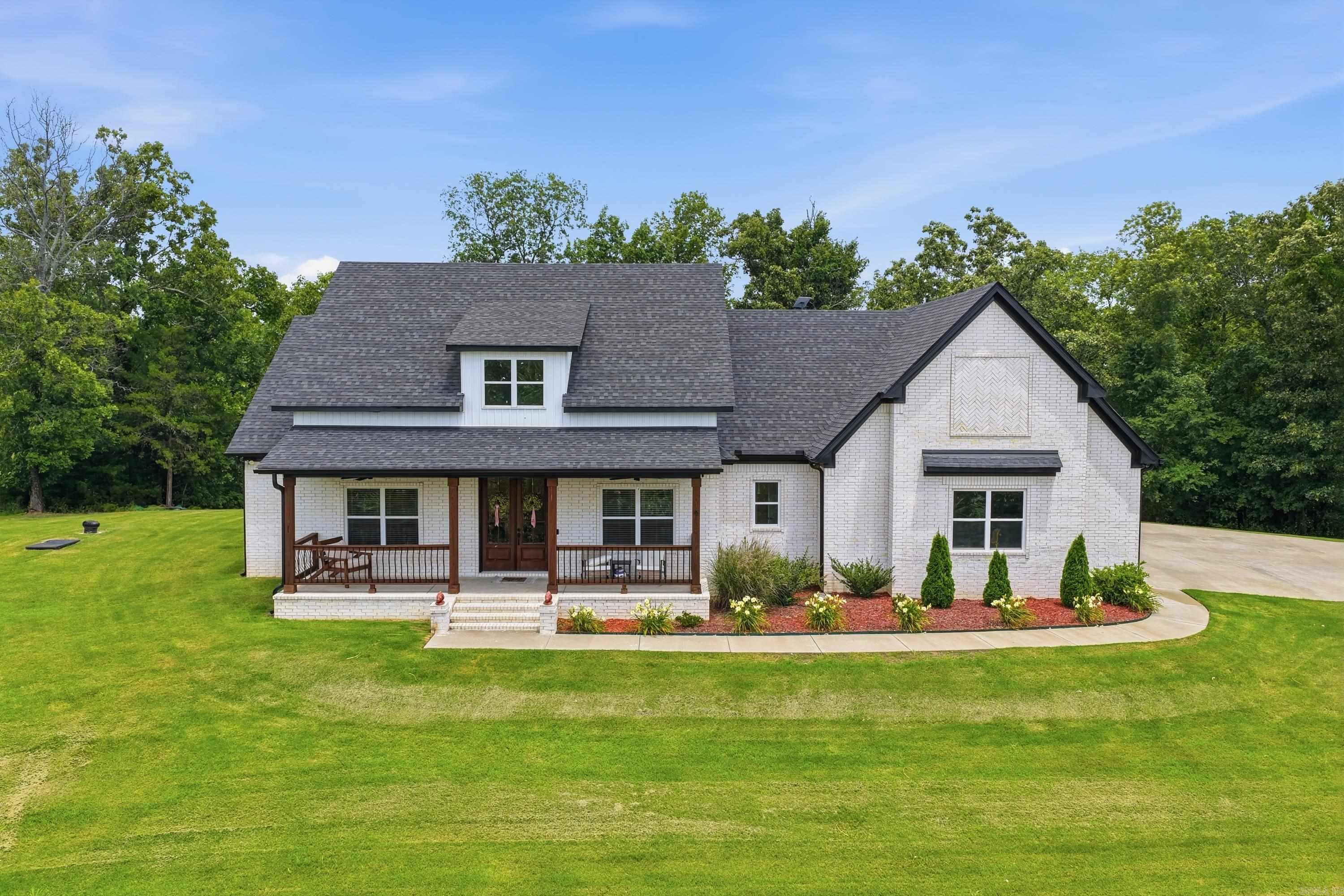 Perched atop one of Vilonia’s highest points, this beautiful home offers breathtaking views overlooking the city and stunning sunset evenings from the front porch. Designed for both everyday living and entertaining, the open-concept layout features a luxurious kitchen that flows seamlessly into the spacious living area, creating the perfect space for gathering with family and friends. With 4 bedrooms, 2.5 bathrooms, and a versatile bonus room ideal for a home office, playroom, or flex space, there is plenty of room to fit your lifestyle. Whether you're hosting guests, enjoying the peaceful surroundings, or raising a family, this home offers the perfect blend of comfort, space, and convenience, all located just 2 miles from the heart of Vilonia.
