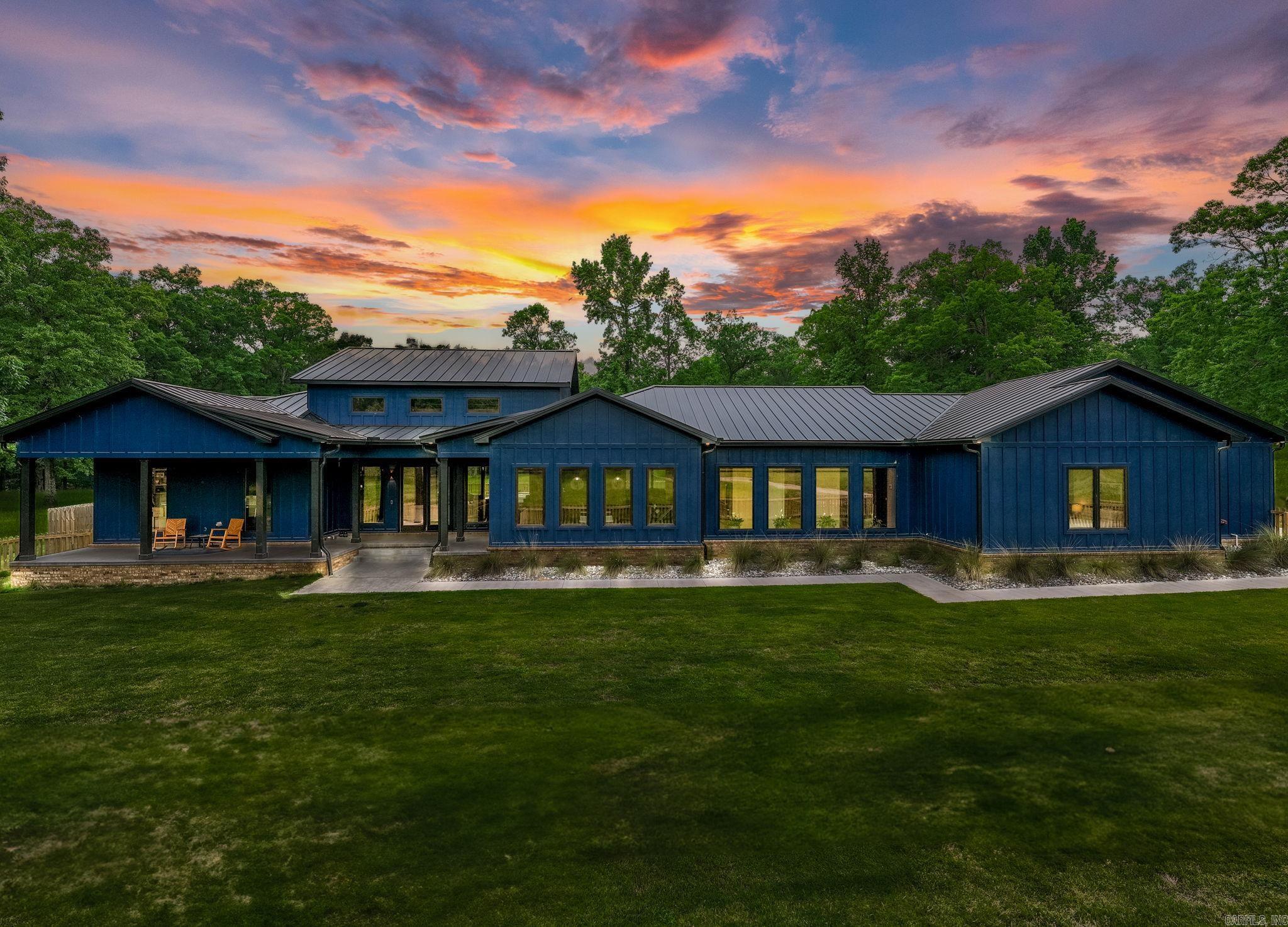 Spectacular Newer construction on gorgeous 20+ acres!  The ultimate setting for family living and entertaining. High quality custom finishes and exquisite amenities set the tone for the best of country living. Fantastic floor plan with soaring ceilings and spacious proportions. Gorgeous beamed family room with fireplace, exceptional chef's kitchen with top of the line appliances, island and large walk in pantry. Resort styed primary suite with luxurious bath. Large guest suites. Fabulous media room/den. Generator. Step outside and enjoy the privacy along with fantastic covered terrace w/outdoor kitchen, stunning pool & sun terrace. Barn with two tack rooms & 6 stalls, and scenic pond - all set on gorgeous land. Your own oasis and personal retreat just minutes from Chenal! Solar powered security gate. Do not miss this exceptional home!