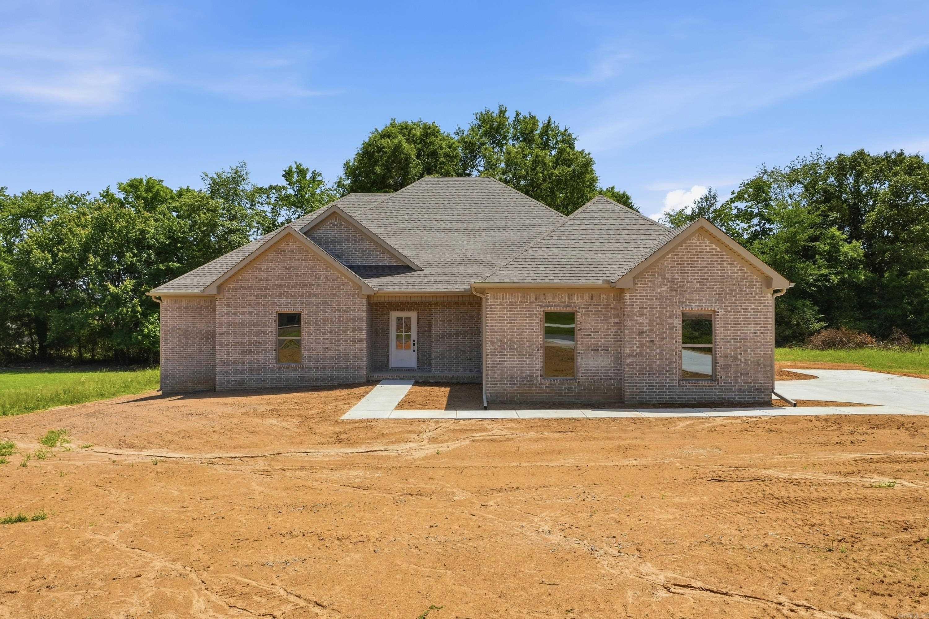 Step into this spectacular new construction four bed/three bath home nestled in a quaint corner of Ridgedale Subdivision in Springhill. Home invites you in with an open kitchen and living room area that looks out onto a large back porch and entertains inside with a beautiful fireplace. The quartz countertops provide plenty of room for work in the kitchen along with added seating. There is a large pantry and a laundry room with access points off the garage and primary suite. The primary closet also provides plenty of room. There are three bedrooms apart, four in total, and be sure not to miss the on-suite/private bath in one of the guest bedrooms. This home is a true find!
