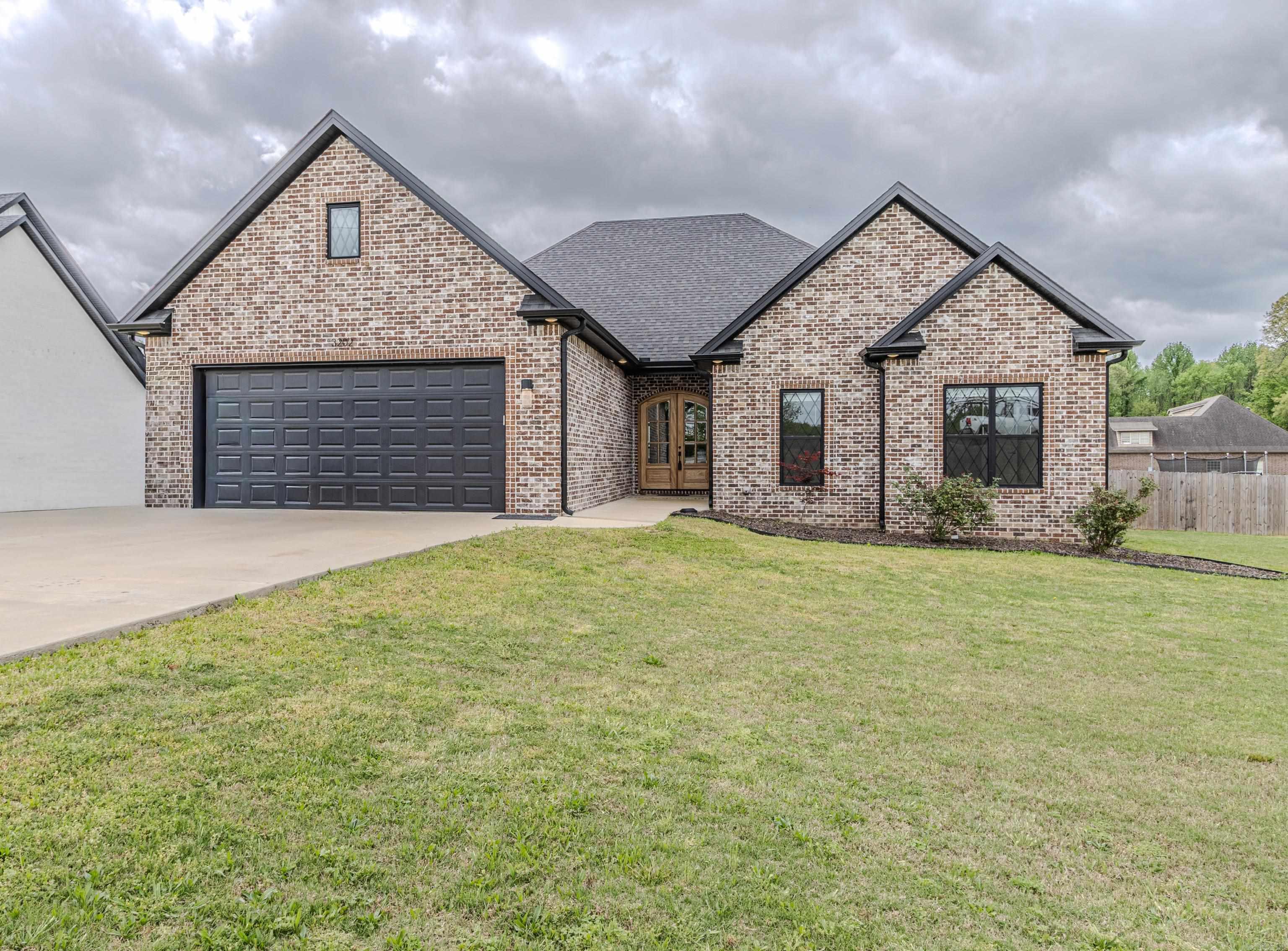 Beautiful approx. 2130 sq ft brick home featuring an open floor plan and thoughtful designs throughout.  Inviting entry with double front doors leads to a spacious living area with a gas log fireplace.  The kitchen offers quartz countertops, under counter microwave, walk - pantry, generous dining space, and refrigerator that conveys.  Large primary suite includes a well appointed bathroom with double granite topped vanities, walk - in closet accessed through double doors and features built - in drawers, shelving and a dedicated dressing area.  Two additional bedrooms are well sized and include walk - in closets.  Exterior features include a fenced backyard, covered patio, and attached garage---ideal for everyday living and entertaining.  See agent remarks