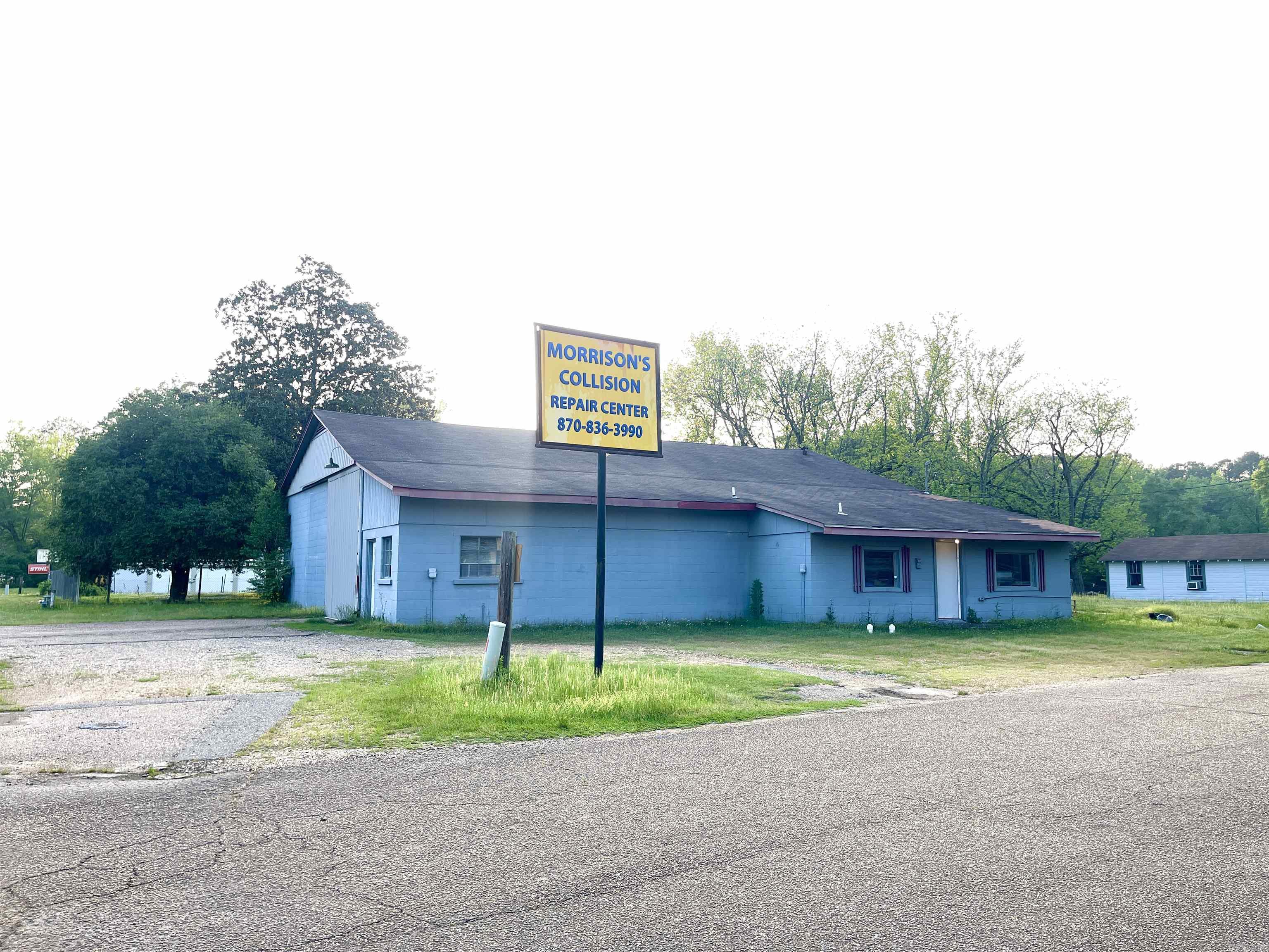 Prime commercial opportunity with versatile uses! Located on a corner lot on California Ave and Abilene St, this property is high visibility with proximity to the amenities of Camden -- just across from In Demand and Mitch Lowe's Body Shop.  Previously configured as an auto repair & collision center, it still includes a compressor room, commercial air compressor, and frame machine.  Pull-through drive with 13.5' sliding doors make access and deliveries easy!  The seller plans to leave the main equipment related to the business with other tools and parts as negotiable features.  However, the space can be repurposed easily into many business endeavors.  If you're looking for location and space, this one is worth looking at!  The layout offers the main workroom, workroom with separate access, office space, 2 half bathrooms, and kitchenette area with storage.   While this has served our community in a specific service for many years, the building offers flexible space for any ideas you may have.  For instance, you can remove the sliding doors and frame in those openings for additional windows or entry options for retail space. Come take a look today!