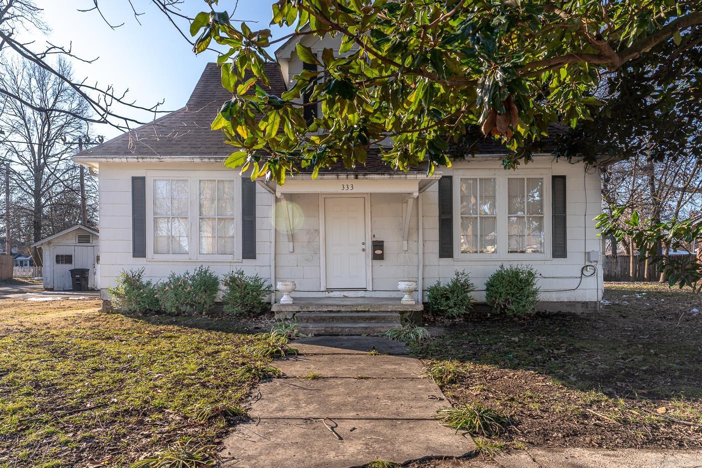 Welcome to Market 333 E Levesque Ave. in Wynne, AR. Step into this beautifully maintained property with vintage charm! This property features original hardwood floors, custom-built cabinetry, and vintage architectural details that highlight the unique character of this home. The property has generous room sizes with plenty of natural light, perfect for creating your dream living spaces. The living room is spacious and anchored by a woodburning fireplace. The yard is fenced in with a wood privacy fence and has an outbuilding perfect for storing tools, lawn mower, etc. Recent updates include new roof on the back of property in 2024, HVAC system in 2022, water heater in 2022, and PEX water lines. The property is currently tenant occupied. The rent is $1,200.00 a month. Whether you are looking to add to your portfolio or buy your next home, give me a call!!