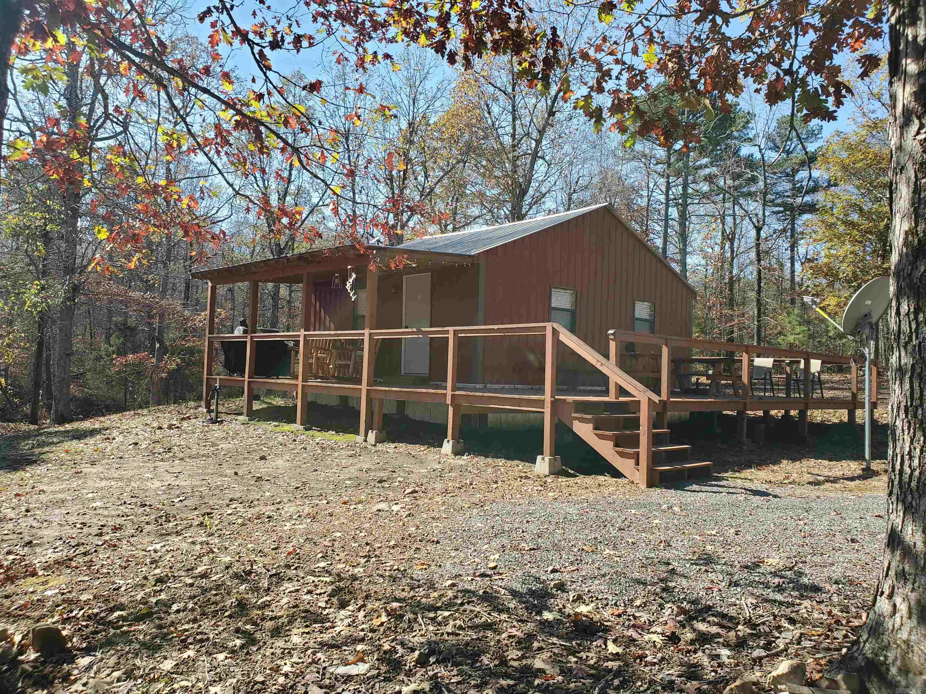 Escape to the woods & discover this beautifully remodeled cabin tucked away on 14.64 acres of serene, wooded land. Whether you’re seeking a peaceful getaway, an outdoor adventure, or an investment property, this fully furnished, turn-key cabin is ready for you to enjoy or rent out as an Airbnb or VRBO. The cabin has metal siding, metal roof, vinyl plank flooring, new appliances including washer/dryer. Explore the 14.64 acres, ideal for hiking, hunting, or simply unwinding in nature. A separate section of land on the property has its own electric meter—perfect for adding another cabin or selling off if you prefer. Located just 40 min from the stunning Greers Ferry Lake, this cabin offers easy access to water activities, boating, and fishing. If you love hunting, you're just 45 minutes away from public land with abundant hunting opportunities & just 1.5 hours from Branson, MO. With close proximity to recreational spots and outdoor adventures, this property provides the perfect balance of seclusion and convenience. Use it yourself, and when you’re not there, generate income by renting it out to visitors looking for a rustic getaway in the woods.