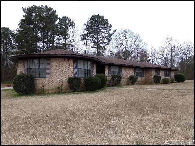 Well built, all brick, spacious home on 7+ acres walking distance to Robert L Davis Elementary. 4 BR, 3.5 BA, 2 living areas, woodburning fireplace, 2 car side load garage. Many updates. Hardwood flooring in den, hallway and bedrooms. New roof 2023. Two newer water heaters. Newer HVAC. See remarks.