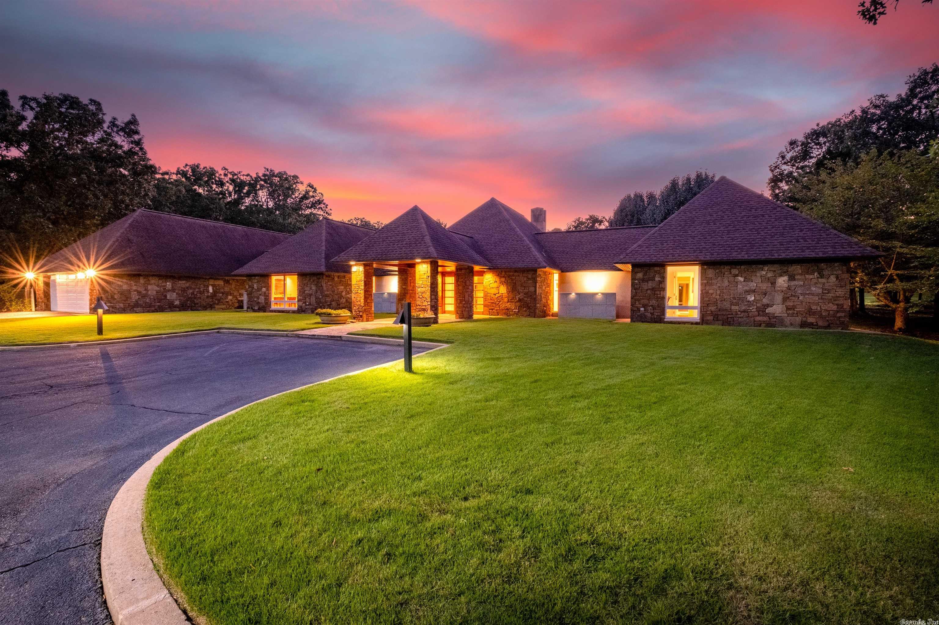 Stunning home & setting! Perfect location. Ultimate privacy on 5 acres in WLR.  Designed by architect Steve Rousseau & custom built by AMR Construction. Flagstone pool & 13,000 sq. ft. patio. Main home has resort style master suite with view of landscaped park area. Updated chef's kitchen. Multiple living areas. Screened in sunroom w/outdoor kitchen. Commercial grade fully equipped 2 BR, 2 bath guest home & wine/entertaining building built in 2016. Tennis course & putting green. See Docs for complete info