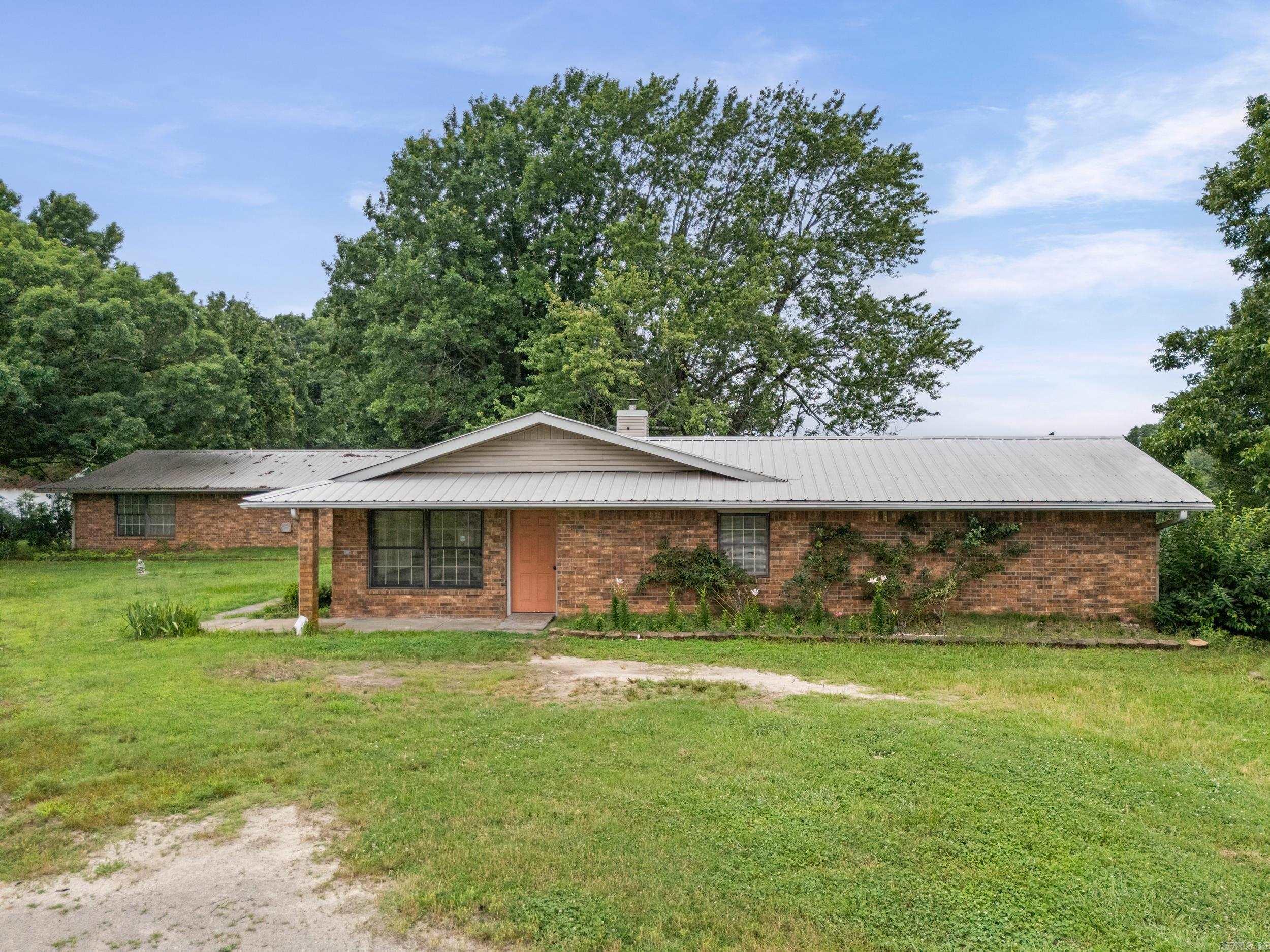 Discover the perfect blend of productivity, privacy, and rural beauty on this exceptional 50-acre vertically-integrated cattle ranch just minutes from Heber Springs, Arkansas. Fully fenced and thoughtfully equipped, this turnkey operation offers everything needed for efficient livestock management and on-site processing. The ranch features 2 corrals, 2 stocked ponds, a large barn, additional pole barn, and a dedicated meat processing facility complete with a walk-in freezer, creating a rare opportunity for producers seeking a self-sustaining agricultural enterprise. An on-site airplane landing strip adds unique convenience and accessibility for business or recreation. At the heart of the property sits a well maintained 3,652-square-foot all-brick home designed for comfortable country living. The residence offers 4 spacious bedrooms, 2 full bathrooms, a cozy fireplace, a durable metal roof, and even an above ground pool. After a day on the ranch, unwind in the private hot tub while enjoying sweeping views of the surrounding countryside. A detached garage provides additional storage and workspace. Seller does not own Mineral Rights. Mineral Rights will not convey to buyer at Closing.