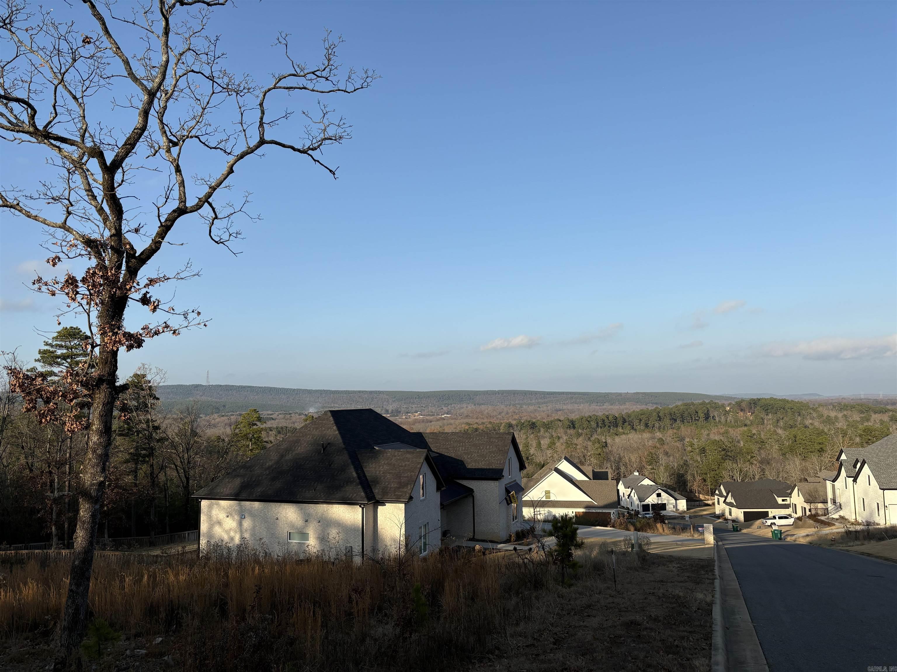 Beautiful lot with an incredible mountain / valley view backing up to a protected green space behind it. This protected green space behind the lot will ensure privacy. Discover miles of walking trails weaved throughout the neighborhood with views of Lake Maumelle and the western Mountain range. Amenities include a tennis court, pickle ball court, basketball court, football and soccer field, as well as a community fireplace and picnic area all inside the gated Waterview Estates!