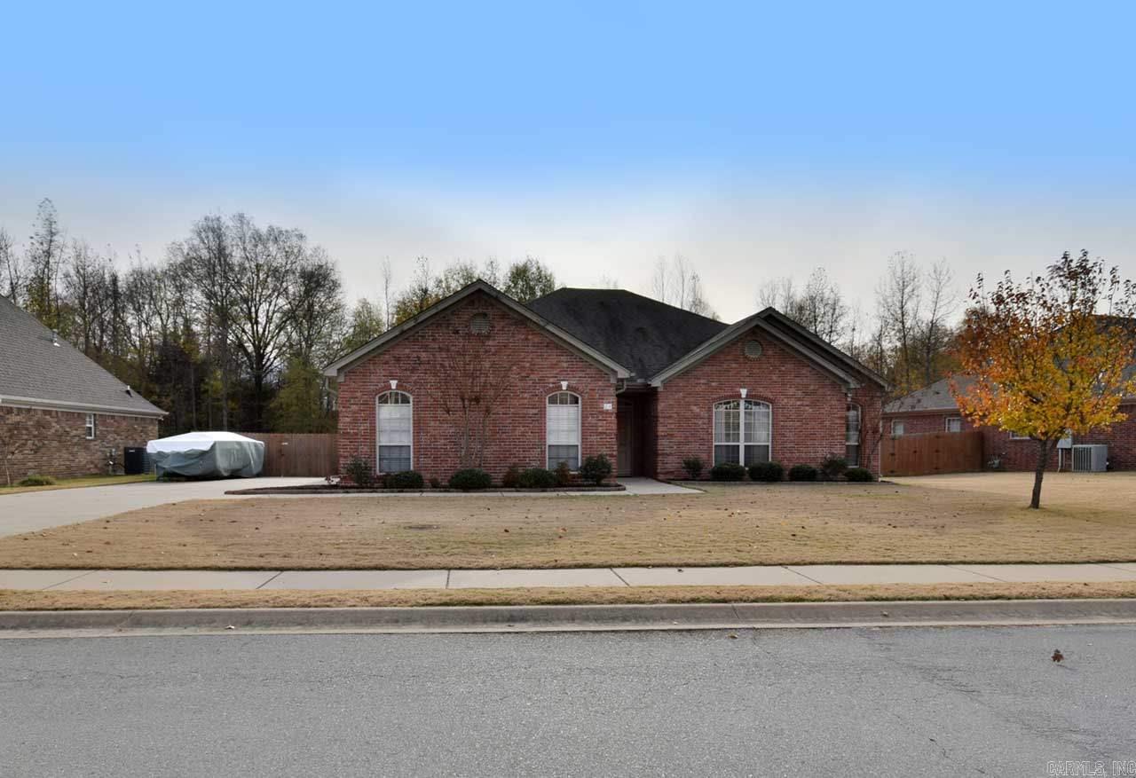 You'll love this immaculate 4 bed 2 bath family home. Features formal dining rm,  gas fireplace, 9 ft ceilings, Stainless steel appliances, new carpet in living rm, new & paint through out. Master suite has large walk in closet, jetted tub and separate shower. Large patio out back with pergola and grilling area, fully fenced back yard Playset to stay w/ house and backs up to woods. Walking bridge to elementary is only 2 houses down. Great community amenities include, bike path, tennis, fishing & playground.