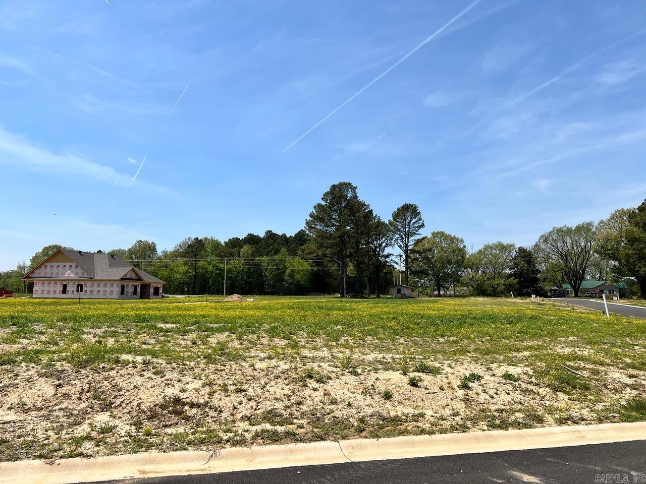Positioned in the Horseshoe Creek Subdivision in Brookland, Arkansas, this 0.35-acre corner lot presents an excellent opportunity to build in a growing residential community within the Brookland School District. The corner placement enhances design flexibility and provides a more open homesite layout, making it well-suited for a variety of custom build plans. The property offers ample space for a thoughtfully designed home along with outdoor living, landscaping, or additional features to match your vision. An appealing option for those looking to establish a new home or invest in land within a well-located and developing subdivision setting.