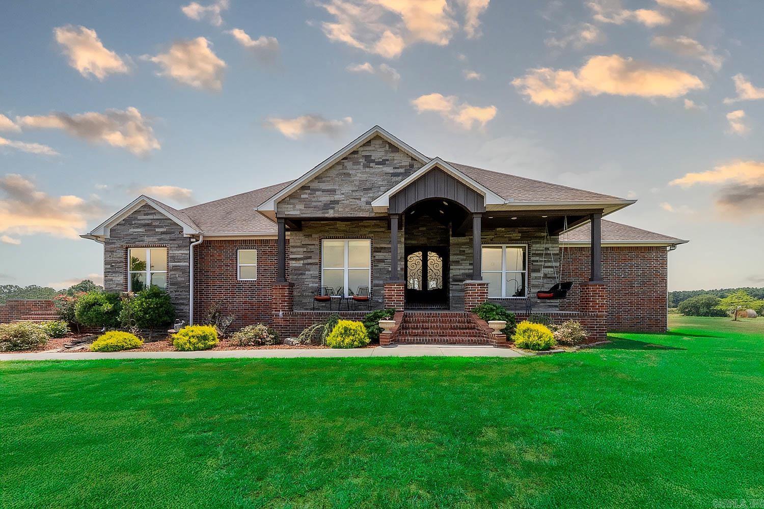 Custom Home on 76 Acres in Hector, Arkansas – Built in 2020  Experience modern country living on 76 beautiful acres with this 3,485 sq ft custom home in Hector, AR. Built in 2020, it offers a spacious layout, high-end finishes, and thoughtful design throughout. The open-concept living area features a custom entertainment center, while the kitchen shines with granite countertops, custom cabinets, and a walk-in pantry.  The home includes 4 bedrooms and 3 baths with quartz counters and walk-in showers. The master suite features a large walk-in closet and spa-like bath. A private mother-in-law suite and an entertainment room add flexibility. The home is fully wheelchair accessible and includes a heated/cooled 2-car garage.  Outdoors, enjoy a covered porch, level yard, mature landscaping, cattle-tight fencing, and a scenic pond. High-speed fiber internet keeps you connected. Choose from 40, 76, or all 96 acres—including fields, woods, and a second pond. Just minutes from the Ozark National Forest, Illinois Bayou, and Russellville.
