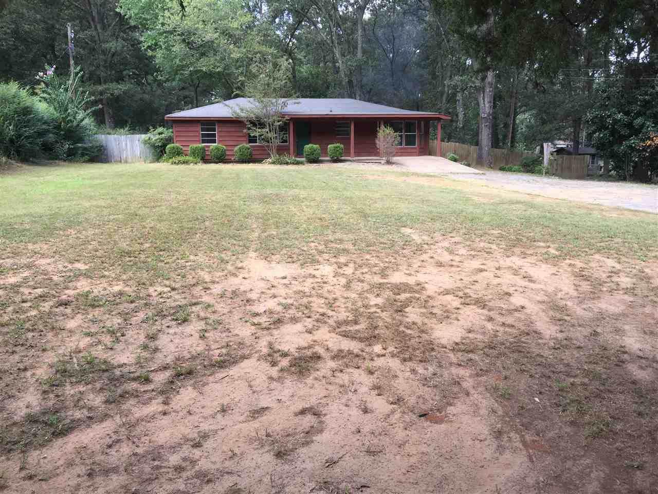 Beautiful Property on almost 3 acres!! This home has a very flexible floorplan with 3 bedrooms and 3 different living spaces including a great space off the kitchen. This home has new carpet, paint, and some new fixtures. Enjoy a new heat and air system and hot water heater installed August 2016! The land is level with a storage unit! Agents see remarks.