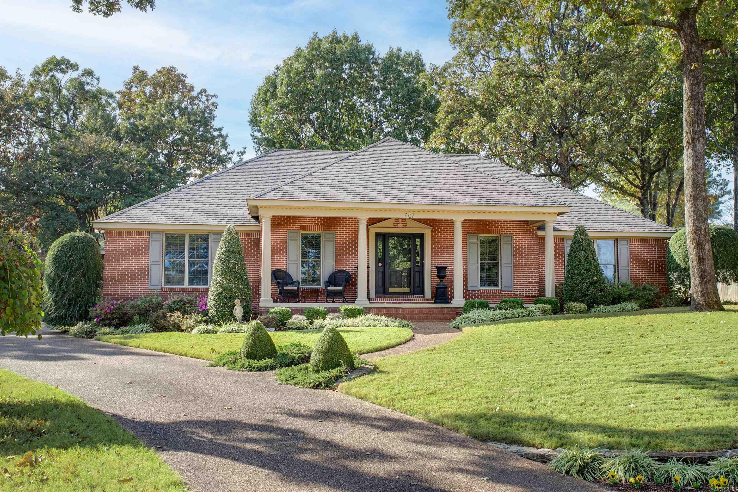 Are you looking for a warm and inviting home with tons of character? Get ready to fall in love with 607 Old Canyon. This traditional style home sits on a large beautifully landscaped lot in the Brentwood subdivision. 4 bedrooms, 2 baths with formal dining room. Tons of custom details from the plantation shutters, crown molding in every room, built-in book cases in the living room and guest room and beautiful trim details throughout. Kitchen features quartz countertops, double oven and breakfast bar. Large primary suite with quartz countertops and walk-in tile shower. Backyard is fully fenced with a picturesque patio and gorgeous landscaping. Sprinkler system in the front and backyard. Just minutes from Craighead Forest Park. This home is a must see! Schedule your tour today!