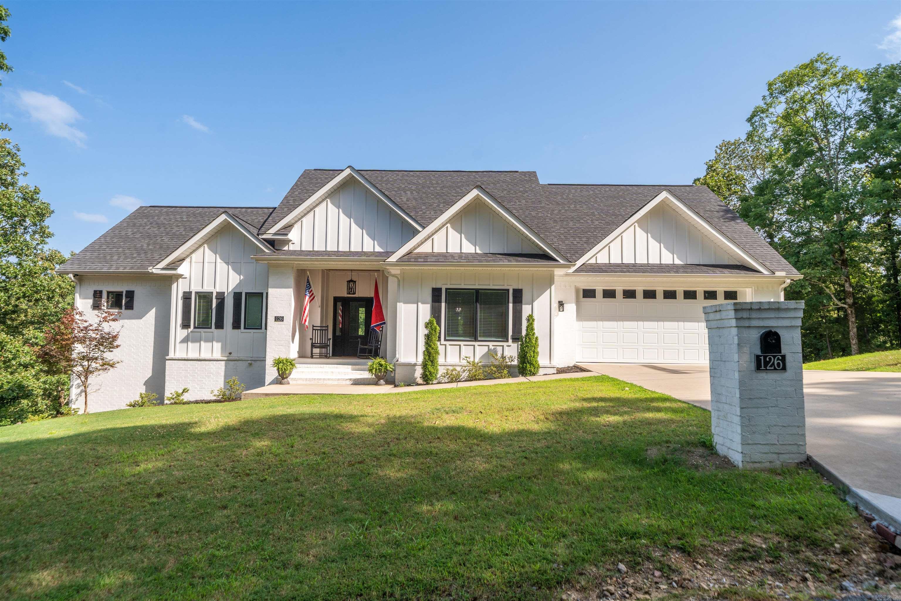Experience luxury living on peaceful Lake Catherine in this 3 story 4 bedroom, 3 bathroom custom home.  Enjoy privacy on the water with a double lot and a 2 stall covered dock with sundeck and lift in a quiet cove. This custom home was built in 2022 and has all the upgraded finishes starting with 6 burner gas stove and double oven with stainless venthood, granite countertops, and a prep island with ample seating. The master suite includes a large walk in closet & ensuite with soaking tub and separate shower. Access the deck from your bedroom for morning coffee as you catch the sunrise. An additional bedroom,3/4 bathroom, & laundry room are on the main level as well. Head downstairs to the finished walk-out basement for a separate living room, 2 large bedrooms and a full bathroom. The basement level has separate mini splits for controlled cooling and heating when not in use. Additionally, there is a huge bonus room over the garage that is currently used as a bunk room and movie room. Outdoor living abounds with an upper an lower deck with screened porches for ample entertaining space. Visit www.diamondheadcommunity.com for all community amenities. Call for your private tour.