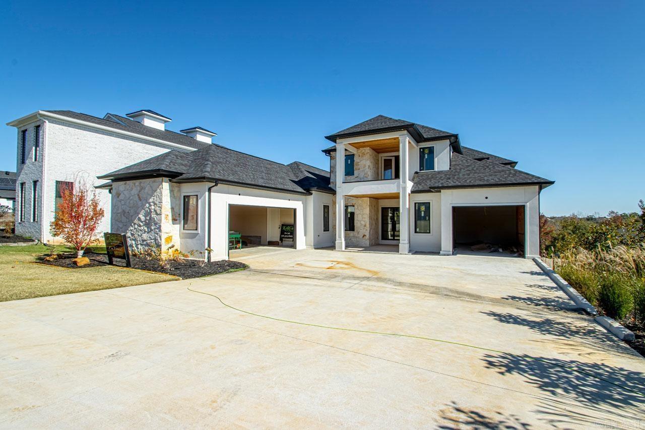 STRATEGICALLY PRICED & OFFERED "AS-IS." Some finish-out MATERIALS could be provided! Lush landscaping, sprinkler system & sprawling approx. 1/2 acre of serene privacy, this new LUXURY RESIDENCE is located in the beautiful development of Stone Hill & CHECKS ALL THE BOXES of LIVING YOUR BEST! The allure of this striking, one-of-a-kind residence boasts expansive floor-to-ceiling windows maximizing an abundance of natural lighting! Open concepts with every detail covered! Exceeding all expectations, this stately home features exotic stone walls, luxury lighting & gorgeous flooring! Enhanced entertaining with DUAL KITCHENS with distinct purposes! EXCELLENT PANTRY & LOTS of built-ins! Exotic granites & an ABUNDANCE OF CUSTOM CABINETRY, designed for SLEEK, ROBUST APPLIANCES & HIGH-END FINISHES! Transform your living experience to the NEXT LEVEL while balancing aesthetics & functionality! Customize your workout w/a PRIVATE FITNESS or ENJOY GAME DAYS in the large THEATRE & MEDIA! Totally detox on three spacious balconies while enjoying that beautiful sunset & light breeze! Lavish primary & dual massaging shower! WARRANTY OFFERED! Appraisal over $1M! Immeasurably more! UPDATED photos soon!