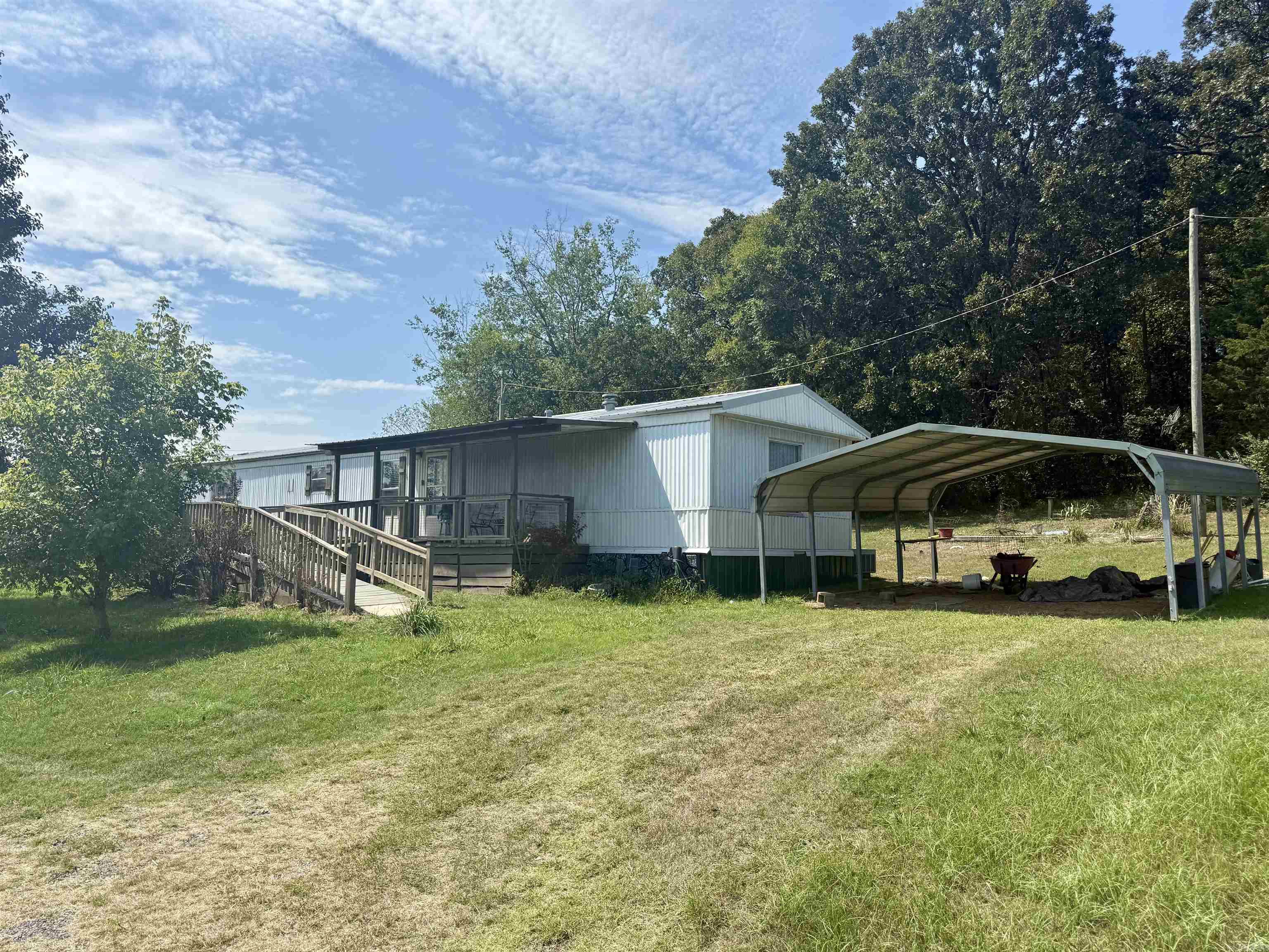 Check out this 3 bedroom 2 bath mobile home sitting off of the beautiful drive on Bee Branch Road. With 7 acres, a barn and storage building, and double covered carport, make this property your own.