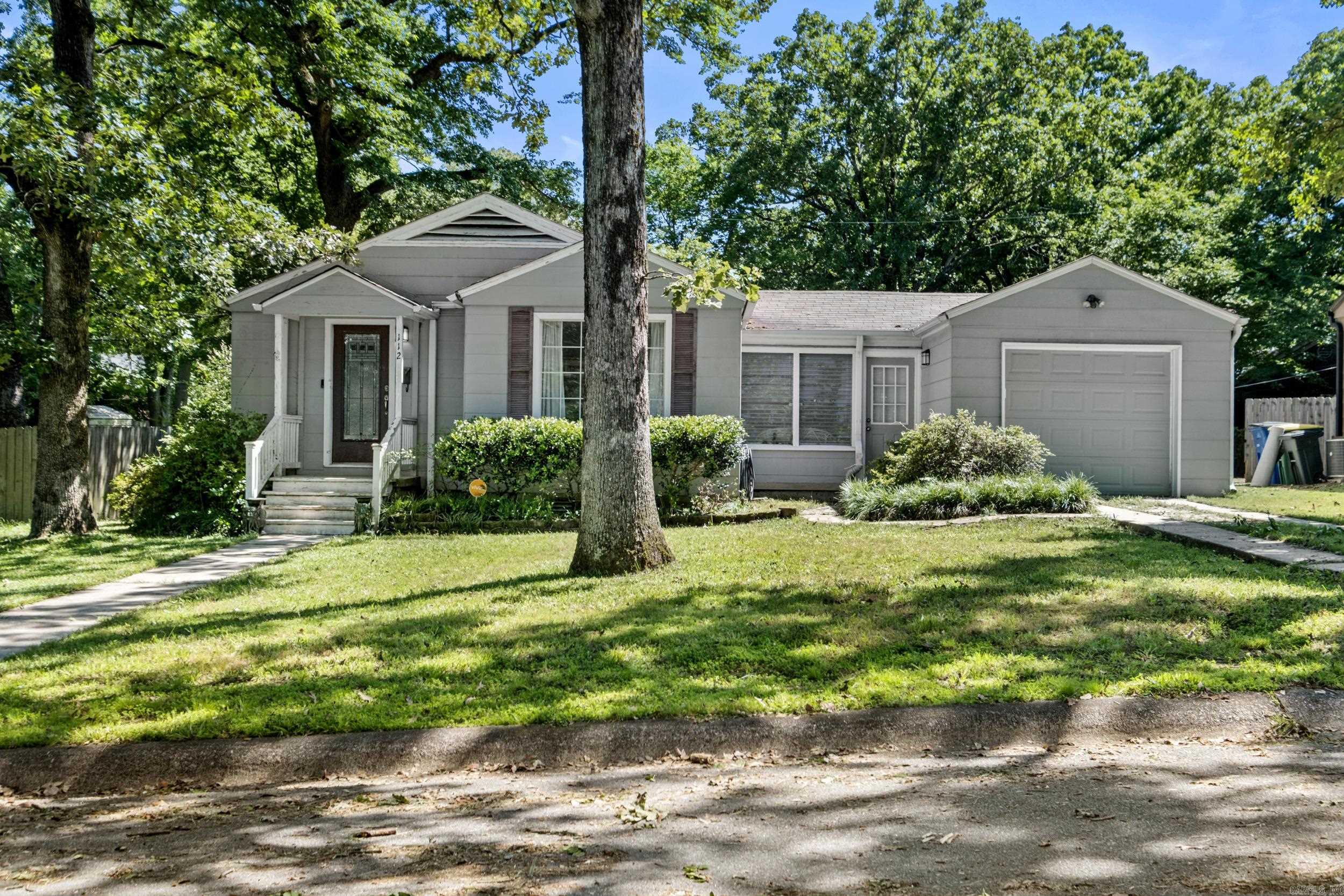 Located in Park Hill Subdivision, this 2 bedroom, 1 bath home is full of charm, character, and potential. Sitting on a nice level lot, the home offers original wood floors, a spacious living room, a large dining room, a one car garage, and a mudroom/sunroom area that connects the kitchen to the garage for added convenience. One of the bedrooms also features a walk-in closet, giving you extra storage that is not always easy to find in a home of this style. The roof is less than 10 years old, and the HVAC has been newly updated, so two important features are already in place. This property is being sold as-is, but the updates needed are mostly cosmetic, making it a great opportunity for someone who wants to bring their own style and vision to a home with solid features already there. The original details add warmth, while the layout gives you comfortable spaces that can be refreshed and personalized over time. With its level lot, garage, updated HVAC, wood floors, and established Park Hill location, this home has so much potential. A little vision and cosmetic updating could make this property shine again and turn it into a beautiful home with classic character.