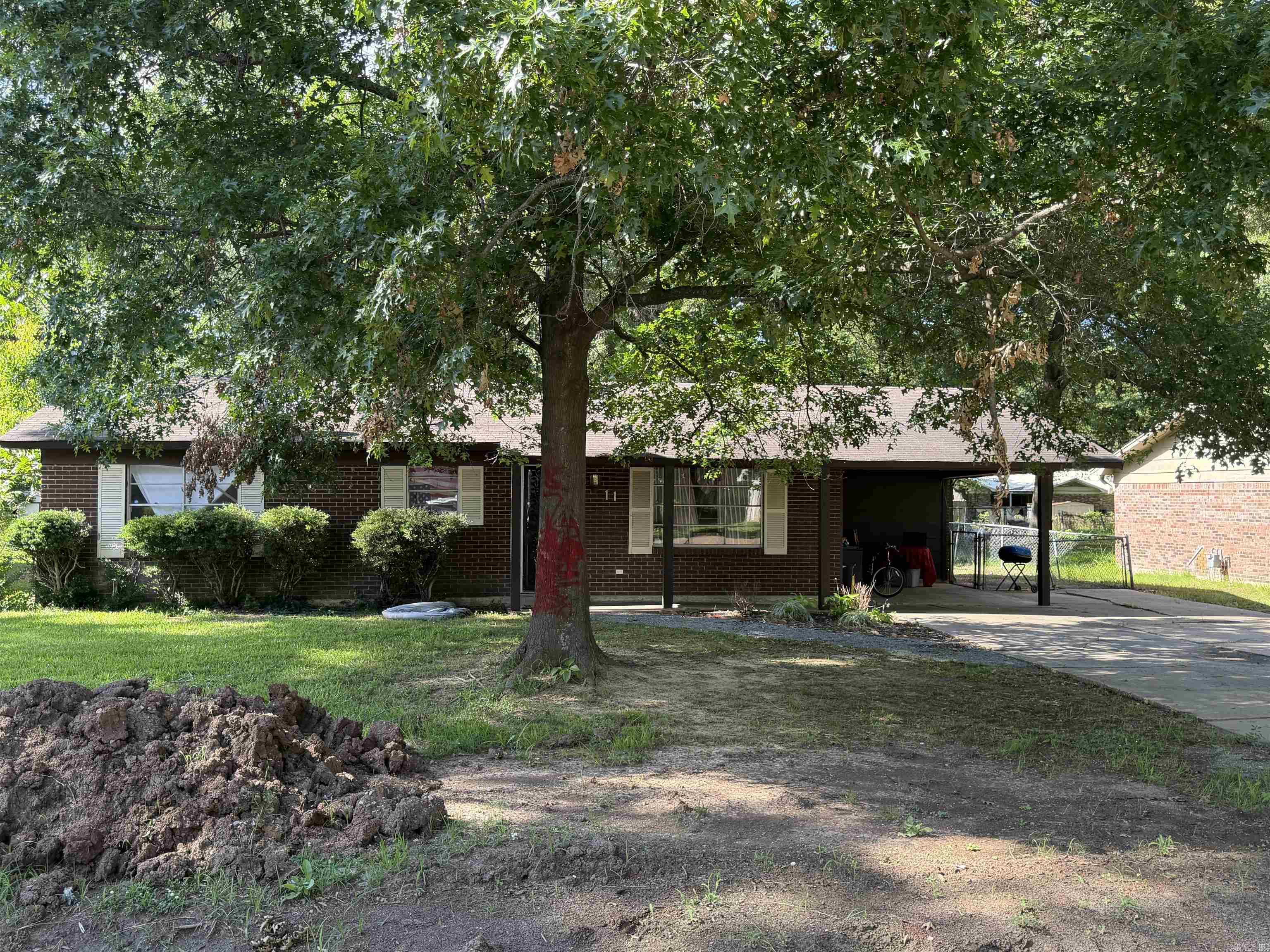 This 3 bedroom brick home is affordable and has a nice shaded lot. It has a 20x25 storage building and a 318 sf carport for your convenience.