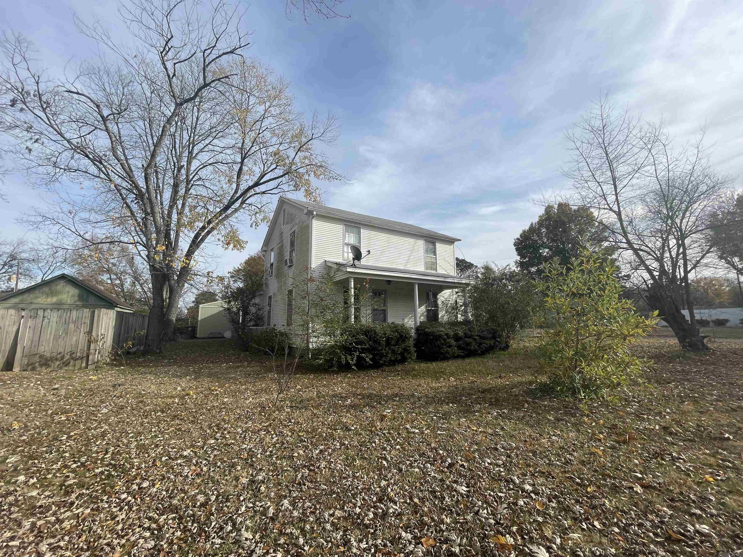 Home remodel & update opportunity! Priced far below typical sales comps to encourage buyers of all types. The remodel needs are a shower that needs to be installed and a spot in the kitchen ceiling that needs replaced. Other needs are cosmetic only. This home will not qualify for RD, FHA, or VA loans. It will require a cash buyer or in house bank loan. It's a 3 bedroom but has a 4th room that could be a bedroom. One upstairs bedroom is large enough some creative work could turn it into two rooms. One bath is upstairs, one down. It has a dining room and has a large laundry/storage/mudroom. Outside detached storage building conveys. Has small storage room under carport also.