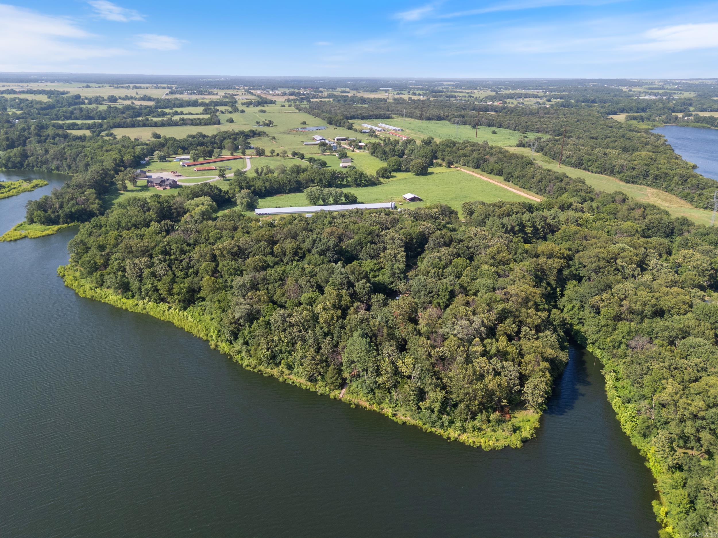 Lakefront Property with 10 Acres – Perfect for a Gentleman’s Farm or Multi-Home Build! This beautiful lakefront property on Lake Flint Creek offers stunning views, direct lake access, and endless potential. Whether you’re looking for peaceful country living, a place to fish, or room to grow, this spot has it all. The home features an abundance of windows that let you enjoy the lake views from inside. Step outside and relax in a quiet outdoor space surrounded by mature trees. There’s also a 352 sq.ft. workshop—great for hobbies, storage, or projects. Property also has a UV System for clean well water! You'll love the extra 5.08-acre lot included with the home, giving you a full 10 acres total. You could build multiple homes, airbnbs, start a farm with the barns, a chicken coop, and gardens, or just enjoy the space for recreation. Lake Flint Creek is well known for excellent bass fishing—anglers come here for the chance to catch large, trophy-sized fish. Whether you're fishing, building your dream setup, or just enjoying the view, this property gives you the space and setting to make it happen. Plus, you're only minutes from schools, shopping, and dining! Schedule a showing today!