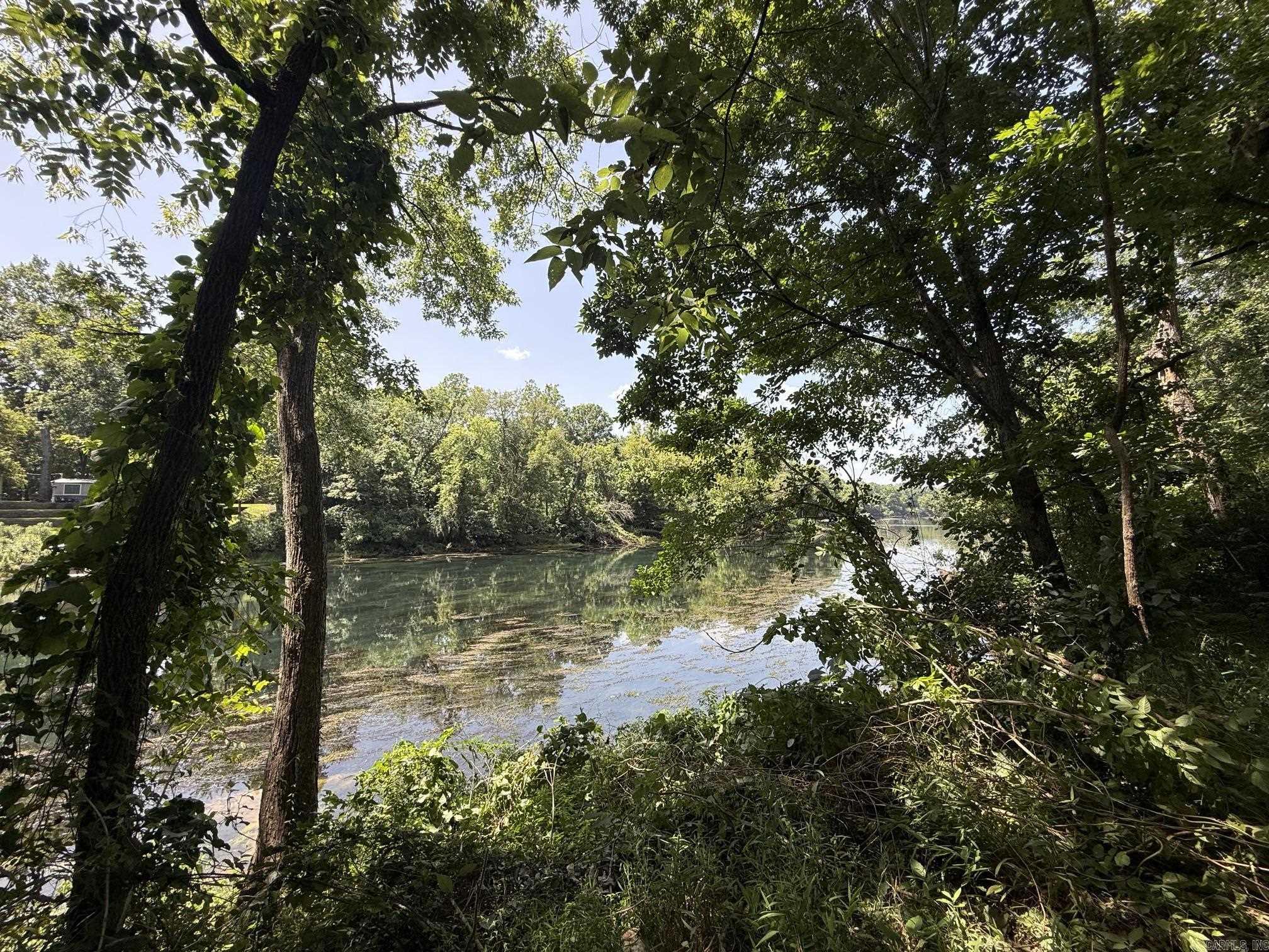 New Development inside the city limits of Heber Springs. River Wood Ranch has flat cleared lots and 19 lots along the river with trees. City sewer and water are available. Boat Ramp and Boat Dock will available by the first of 2027 for use by the residents of the subdivision. There are 8 lots that back up to the lake with views of the lake and Sugarloaf Mountain. Roads are currently gravel but as the lots are developed the roads will be paved.