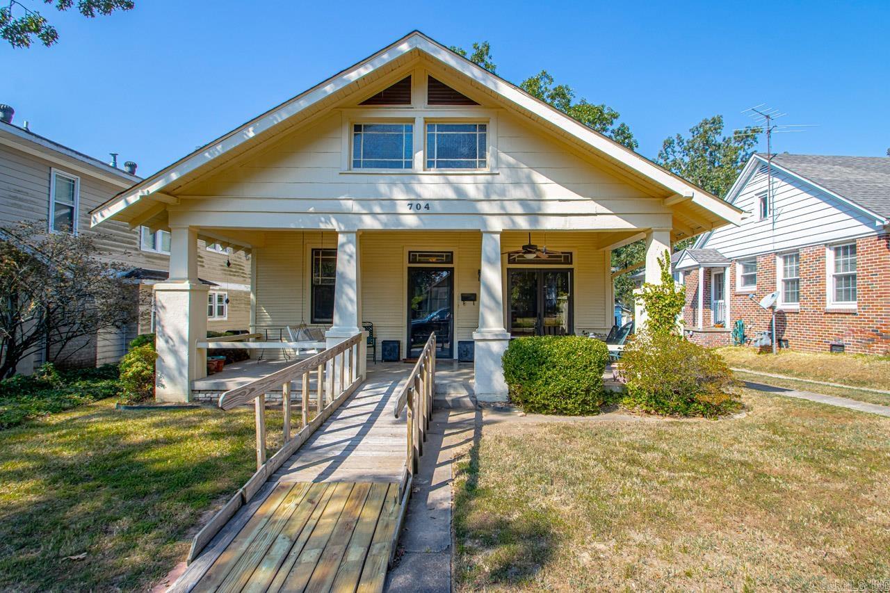 Come check out this truly historical Hillcrest bungalow in all of its convenience and charm! Just within walking distance to all shops and restaurants in Hillcrest Historical District and centric city location. Stepping up to the front door you’ll notice the lovely front porch with a built in porch swing. The layout features an open living room and dining area with architectural embellishments of coffered ceilings and built in columns. Moving to the right off of the living/dining area, you find the off-kitchen breakfast area, kitchen and laundry room. To the left, you’ll find the bedrooms and bathrooms with ample closet space, a master with conjoining office space and in-suite master bathroom. Additionally, off of the laundry room you have a back patio leading to a fully fenced backyard and a 2 car spaced garage. Original 1930’s hardwoods and 10 ft ceilings throughout the home  and original bathroom tile give this bungalow a classic and timeless appeal. The roof was replaced in 2016. All appliances convey. Shared driveway and shared garage structure (2 of the 4 garage spaces are on 704 N. Monroe property).