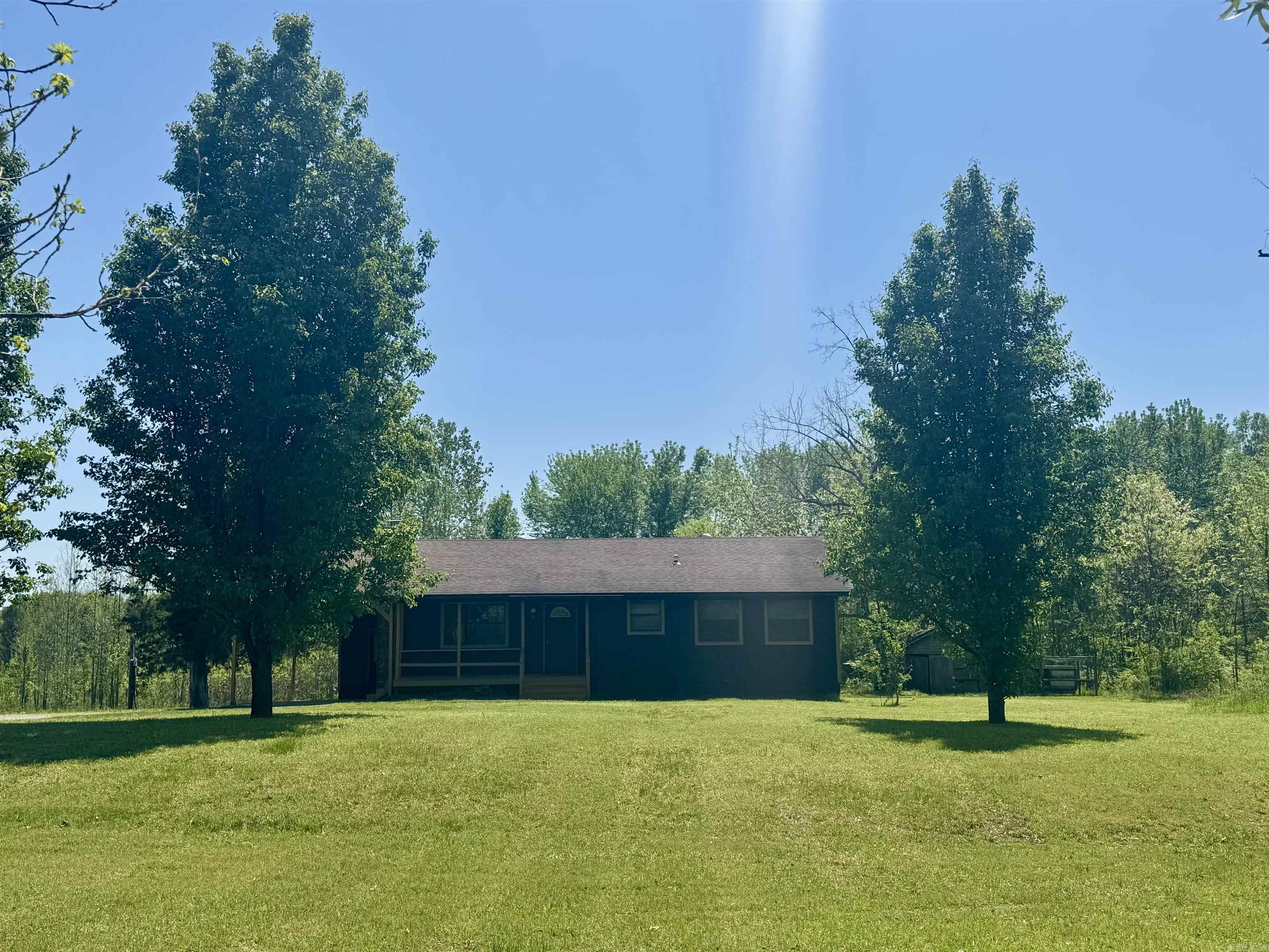 Check out this brand new listing in Wooster! This charming 1,524 Sq.Ft. 2 bed/1.5 bath home with a large bonus room with a closet. This cozy home sits on a spacious 3.3 acres and has mature trees with lots of privacy. Enjoy the view from your covered front porch. This home was recently modeled, repainted and had LVT floors put in main living areas. The living room has a vaulted ceiling with a wood burning fireplace. In the kitchen, a brand new gas range has been installed. The refrigerator conveys with this home! Central heat & air are in the main living area & a window unit and electric heater are in the bonus room. We just had a recent home inspection and the contractor is going to be starting repairs soon! A brand new architectural shingle roof will be added before closing day a value of over $10,000 as well as a half bath in the bonus room a value of $2,500. This home is in award winning Greenbrier school district and only 1.9 miles from Wooster Elementary & 2.7 miles from Greenbrier High School. Only 13 min through Wooster to the interstate and only 16 minutes to Conway on Hwy 65! Oh and there is a shed in the backyard with a chicken coup and dog kennels! Agents see remarks!