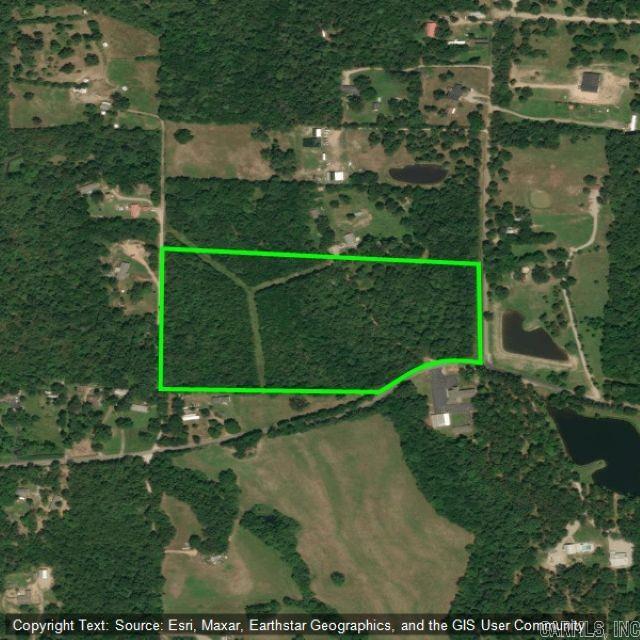 Royal area land tract with frontage on three roads. About 18+ acres. Mainly wooded land with a non-exclusive road easement through one part of the property for another residence on North side. Creek runs through part of property. Some utilities including water and electric available to property. Some information taken from county records, i.e., acreage total, taxes, picture for approximate location and shape, etc. Please feel free to verify.