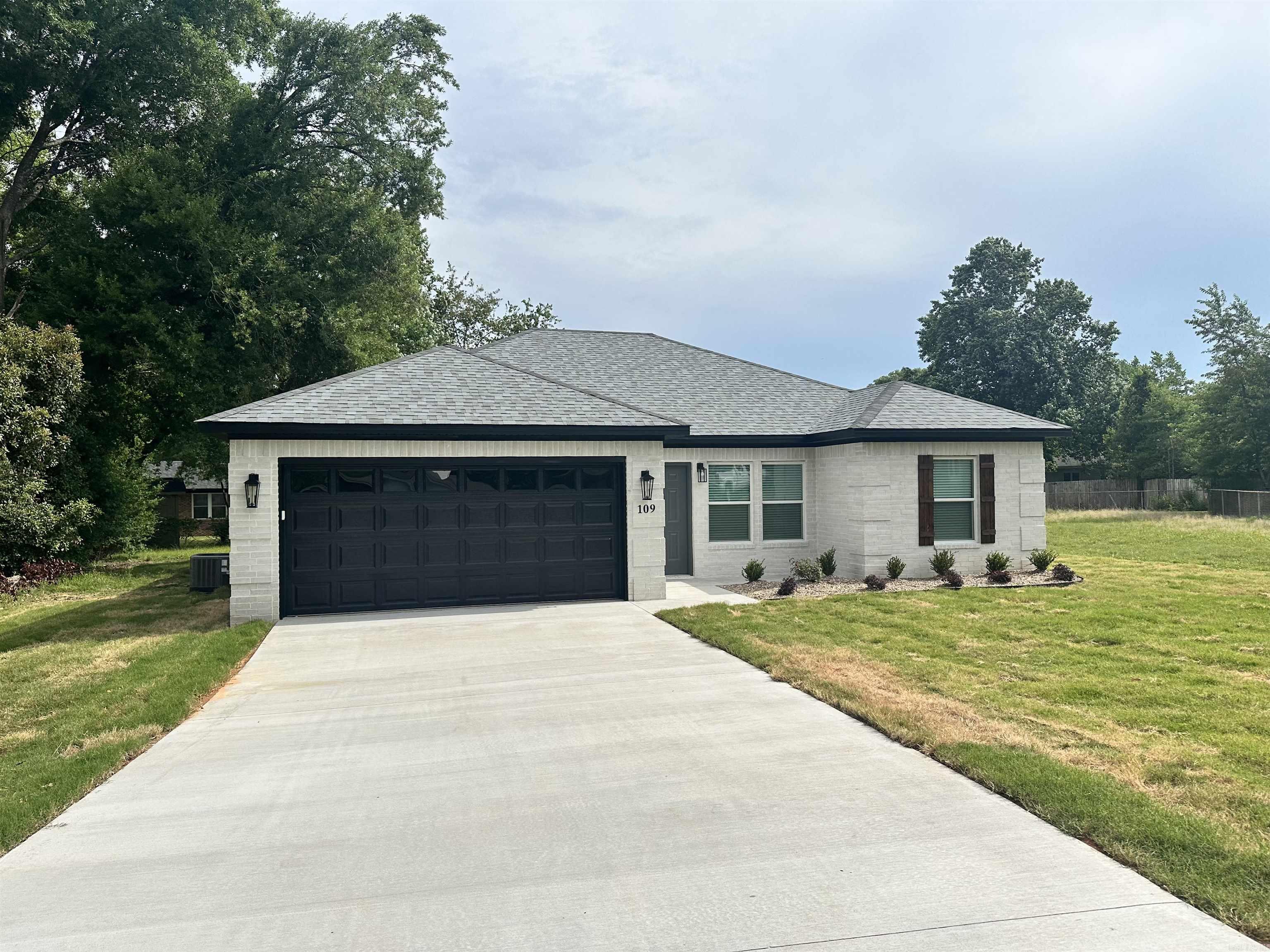 Beautiful New Construction in Jacksonville, AR! This stunning 3 bedroom, 2 bathroom home offers modern style and an open-concept layout perfect for everyday living. Features include vaulted ceilings, luxury wood-look flooring, recessed lighting, and a spacious living area filled with natural light. The designer kitchen showcases custom white cabinetry, stainless steel appliances, matte black fixtures, and gorgeous quartz countertops with bold waterfall-style veining. Situated on a large lot with great curb appeal, this move-in ready home combines comfort, style, and convenience from schools, shopping, dining, and Little Rock Air Force Base.