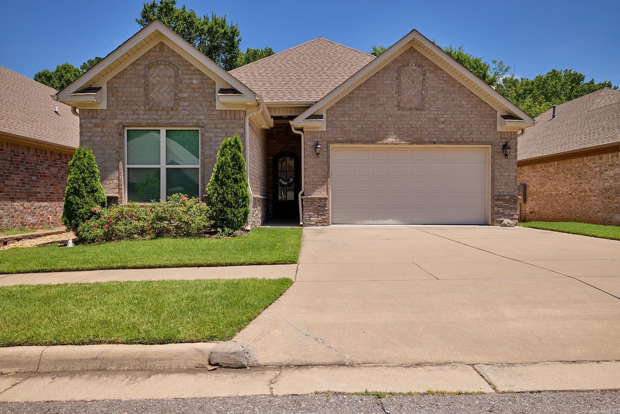 Welcome to this beautifully maintained 3-bedroom, 2-bath home located in the desirable Hunters Crossing gated subdivision in Bryant. This move-in ready property has been exceptionally cared for and showcases pride of ownership throughout. The spacious great room features a wonderful fireplace, elegant crown molding, and tall ceilings that create an open and inviting atmosphere. The well-designed floor plan offers comfortable living spaces perfect for everyday living and entertaining. Step outside and enjoy the wonderful patio overlooking the fenced backyard, providing the perfect space for relaxing, grilling, or spending time with family and friends. Conveniently located just minutes from shopping, dining, schools, and other everyday amenities, this home offers the perfect combination of comfort, convenience, and security within a gated community. Don't miss the opportunity to make this beautiful Bryant home yours!