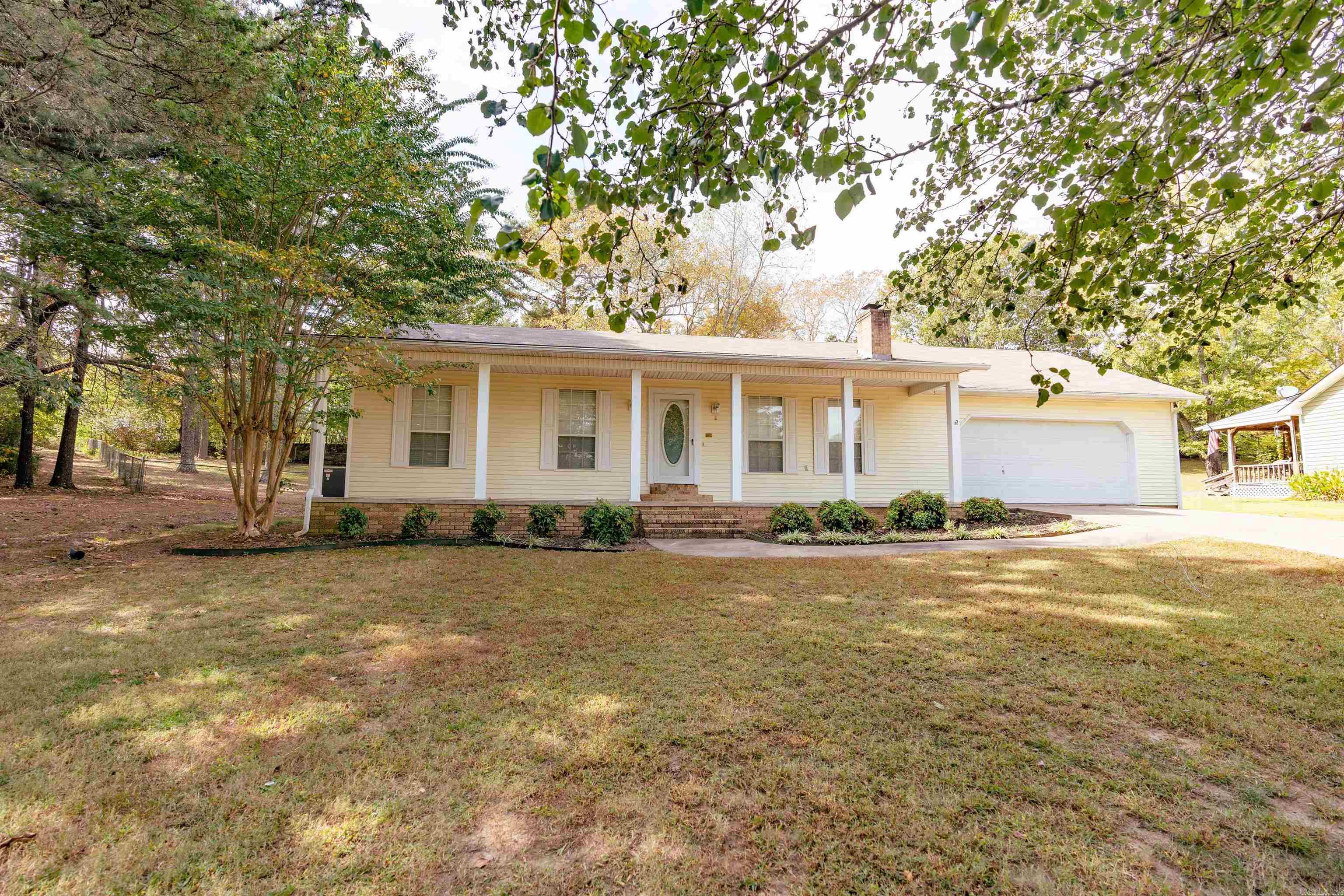 Hidden away in a cul-de-sac but convenient to everything, this home has had lots of improvements and updates since Seller purchased.  New 16 x 20 metal shop has electricity, insulation, and overhead door.  Home has new luxury vinyl wood floors through out, gas range & microwave new in 2020, dishwasher new 9/23, crown molding and windows trimmed out in some rooms, new subway tile backsplash in kitchen,Gas HVAC new in 2021.  Wood Burning Fireplace has a new gas log insert that is vented through roof and a new mantel, fully fenced back yard, french drain installed, and attic insulated to code.  Do you like fresh eggs?  There is the cutest chicken coop nestled in the corner of the back yard that was made for 6 chickens.   Call today for an appointment.