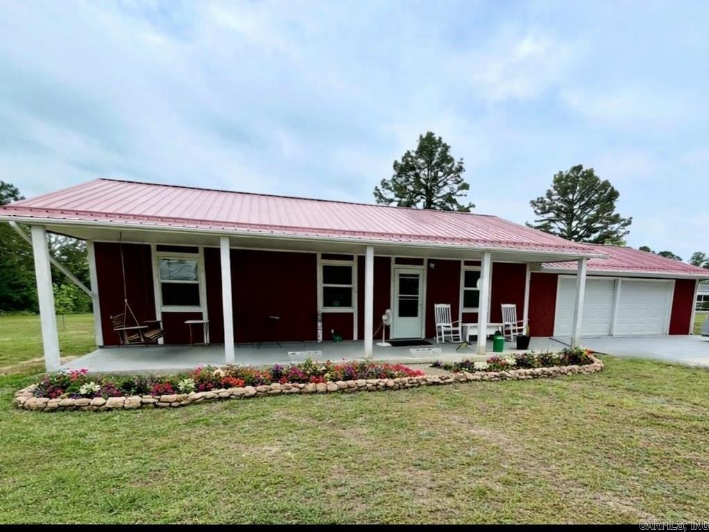 This charming home offers approximately 1,120 square feet of heated and cooled living space, along with an additional 624 square feet of attached two-car garage that was built in 2025 (not included in living area), for a total of 1,744 under the same roof. A covered front porch which is not include in total. There is a nice storage building also.  Situated on a beautiful 2.02 acres more or less minutes from the town of Clinton not far from lakes, rivers and streams and only two hours to Branson Mo. the location is ideal. The spacious yard is beautiful, with mature fruit trees and blooming flower, creating a relaxing outdoor retreat with plenty of room to enjoy.