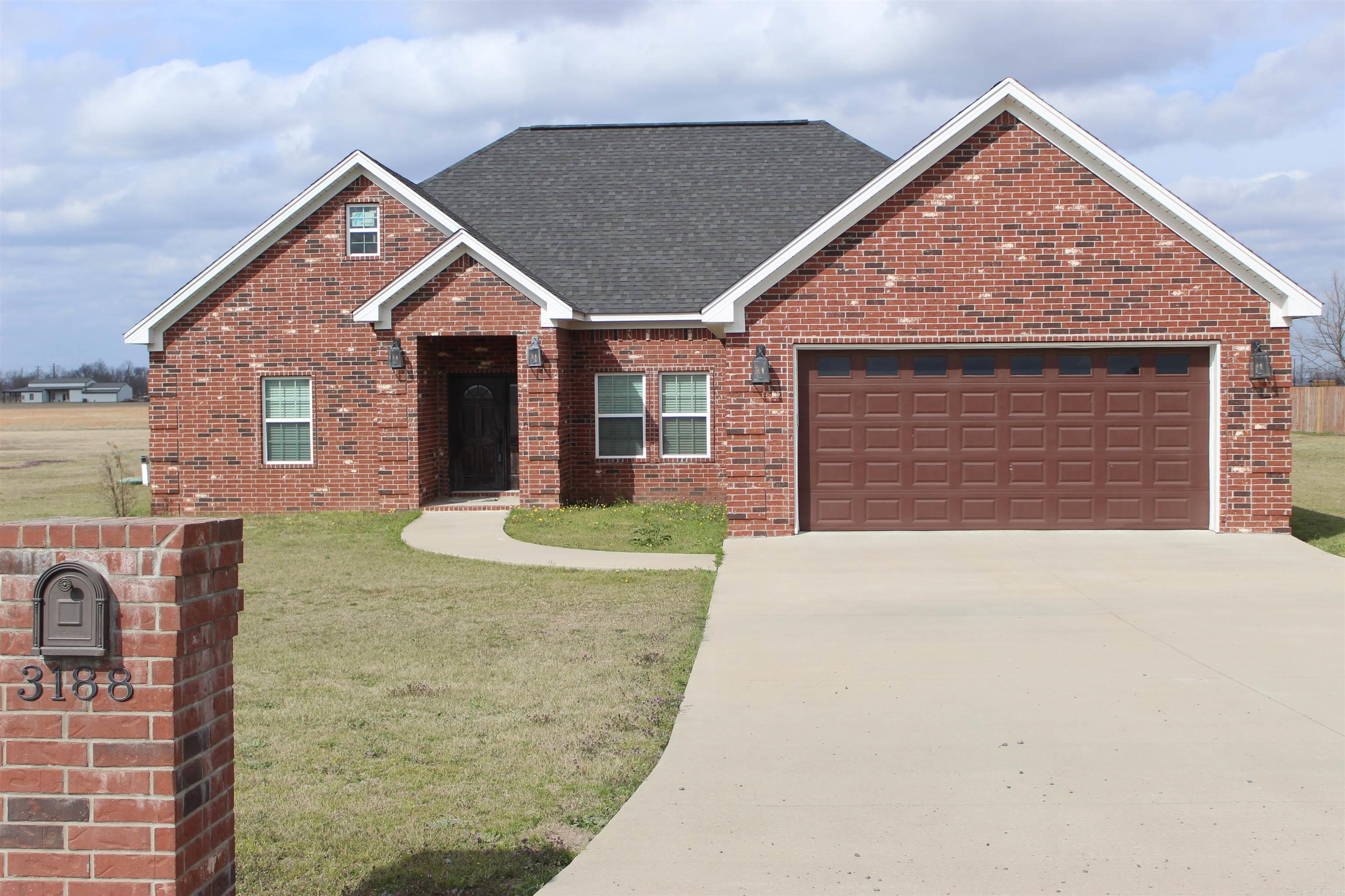 Just 20 minutes from all of the amenities Little Rock has to offer, this home has the small town qualities and serenity that captures both the type who can raise a family, or the empty nester with a green thumb looking to take advantage of that acreage of land.  Inside the home, high ceilings with crown molding, a spacious master bedroom and bathroom with a walk in closet.  Take a look at the showers in the bathroom that are equipped with dual overhead and frontal waterfall showerheads.  Also, standard walk in closets in all bedrooms.  Open concept living area and kitchen with a quartz countertop island. The home is equipped with a high-efficiency commercial-grade, in-ground septic system, reliable HVAC, and is connected to a community water system for added convenience.  Schedule a showing and take a look for yourself.  *See Agent Remarks*