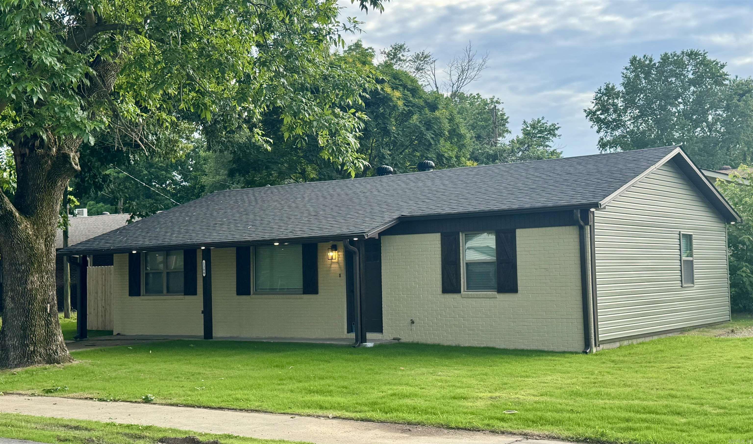 Agents See Remarks Completely remodeled home inside and out. Enjoy the modern exterior upgrades including new roofing, brick exterior, siding, soffit and fascia, expanded driveway, added patio, new windows, doors, shutters, and exterior lighting. This home's interior has also been rebuilt from the ground up. New LVP flooring, drywall ceilings and walls, paint, and interior doors have been installed. Your electric bill will benefit from the efficiency of a 2022 HVAC system with new ductwork, 6" walls with new blown in wall and attic insulation, and a new electric water heater. The kitchen was completed with white shaker cabinets, quartz countertops, deep stainless undermount sink, Kohler faucet, garbage disposal, and a complete suite of new Frigidaire stainless steel appliances. New fiberglass tub/shower units and vanities are adorned with quartz countertops, Delta faucets, and complimented with Kohler toilets. Enjoy the bright spaces inside and out accentuated with several LED light fixtures. New ceiling fans and 2" faux white wood plantation blinds complete the spaces for comfort and privacy.